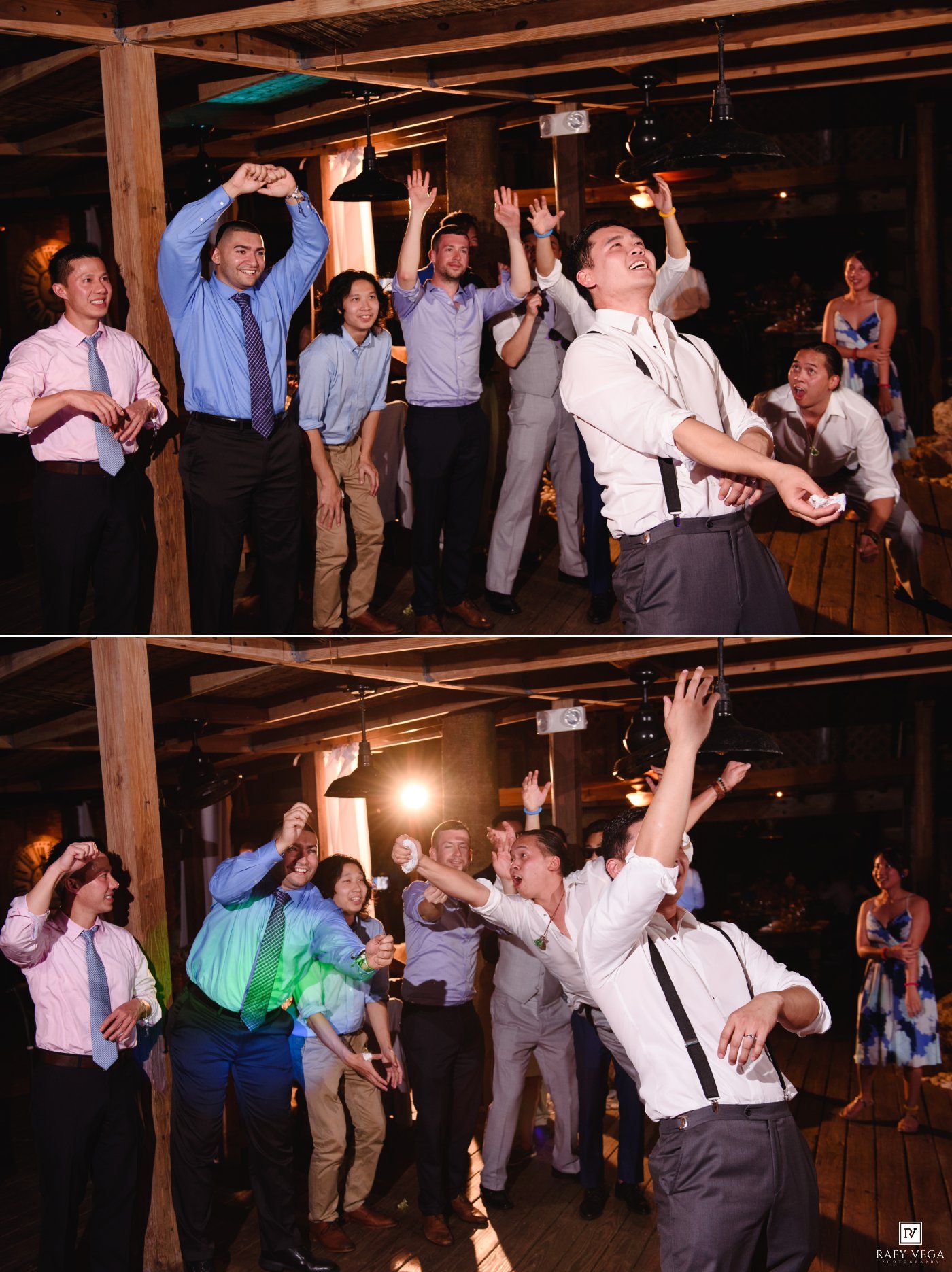 Groomsmen laughing and dancing at a rustic barn wedding reception, reaching up to catch the garter toss.