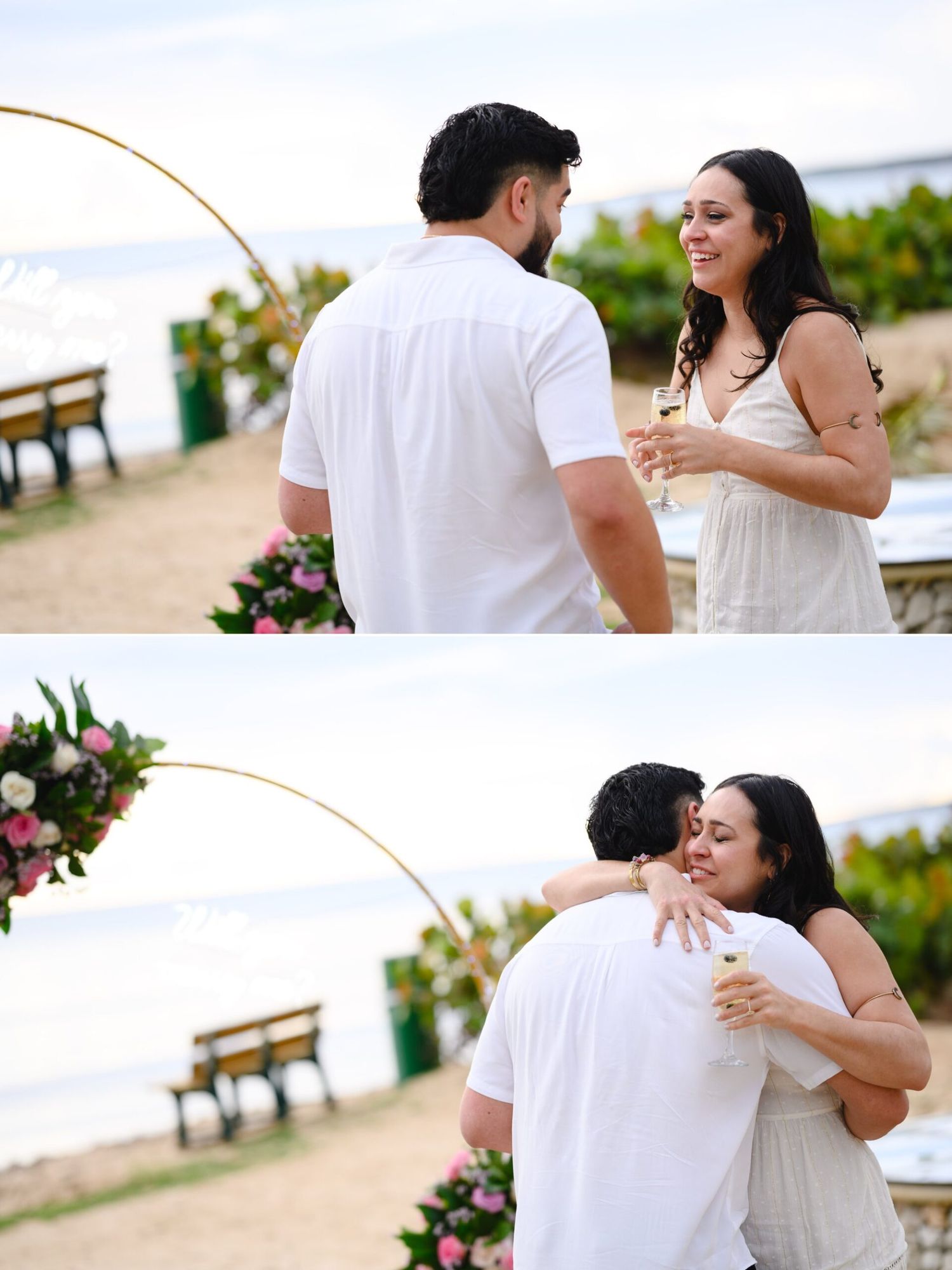 Couple sharing a romantic beach proposal moment, embracing under a golden arch with tropical floral arrangements.