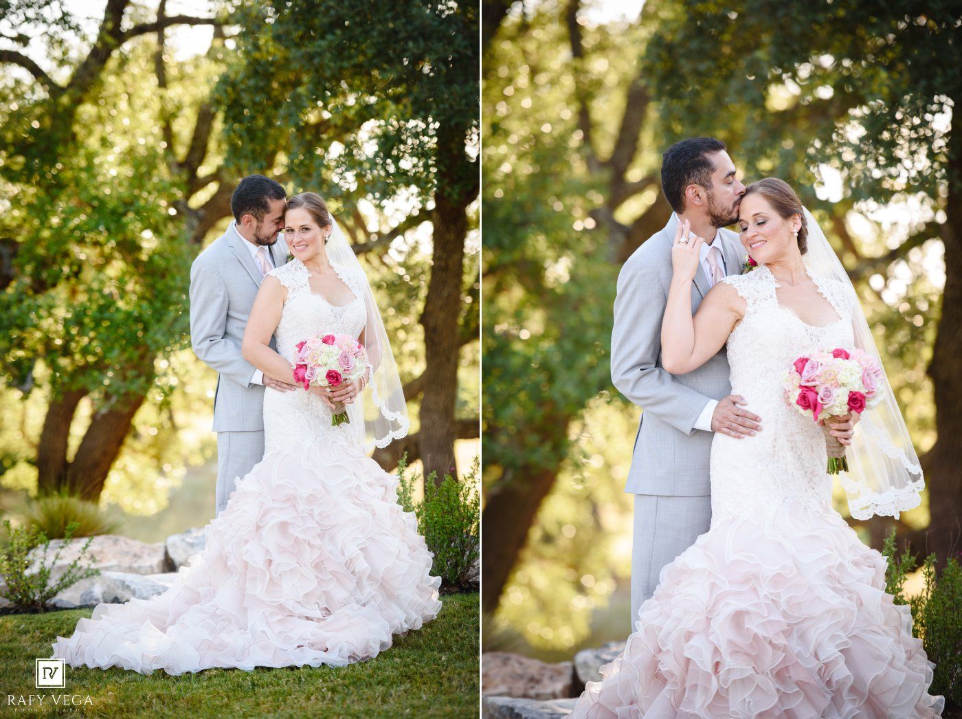Wedding couple poses outdoors with bride holding pink bouquet in a ruffled white gown and groom in gray suit.