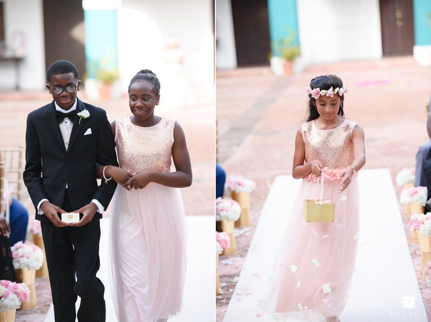 Young ring bearer and flower girl in elegant wedding attire walking down the aisle at a ceremony.