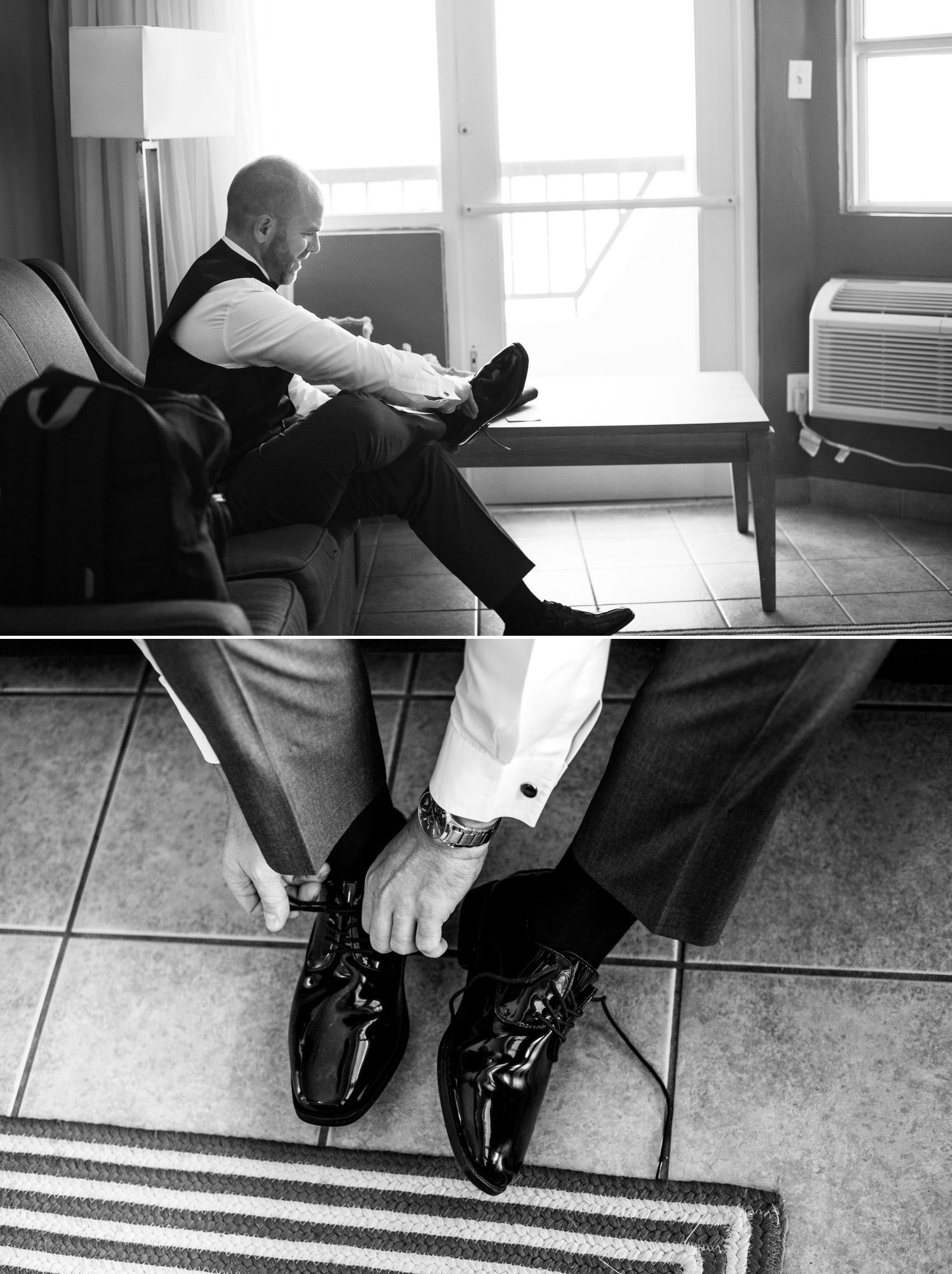 Black and white wedding photo of groom putting on shiny patent leather dress shoes while getting ready.