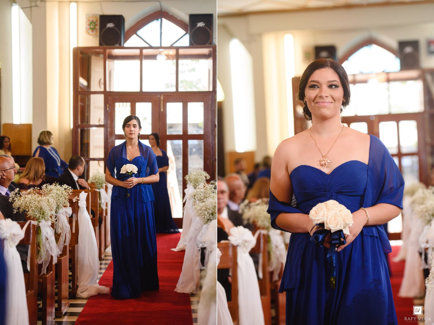 Bridesmaid in royal blue gown walks down red carpet church aisle holding white bouquet during wedding ceremony.