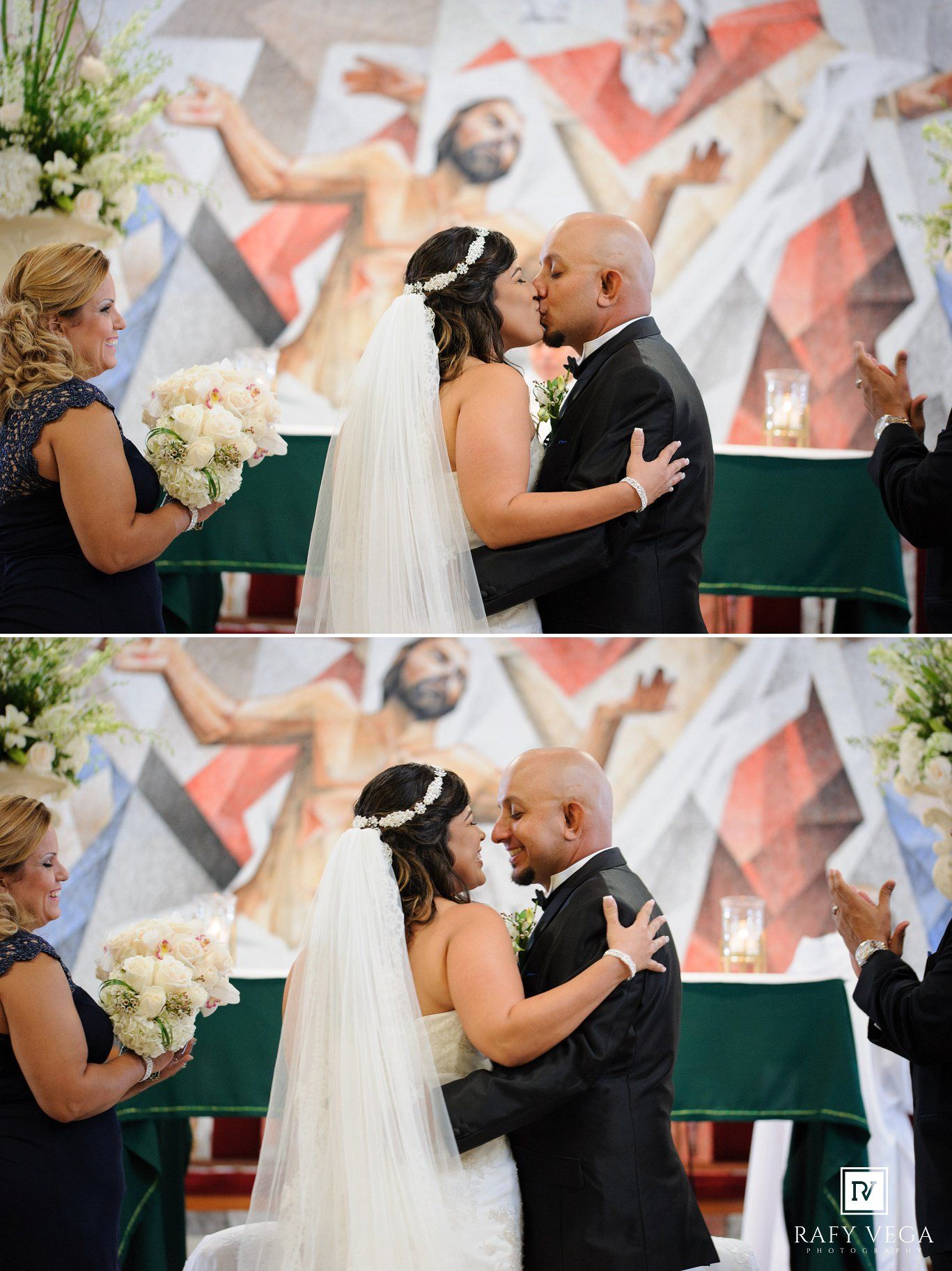 Bride and groom share their first kiss at a church wedding altar with a colorful religious mural backdrop.