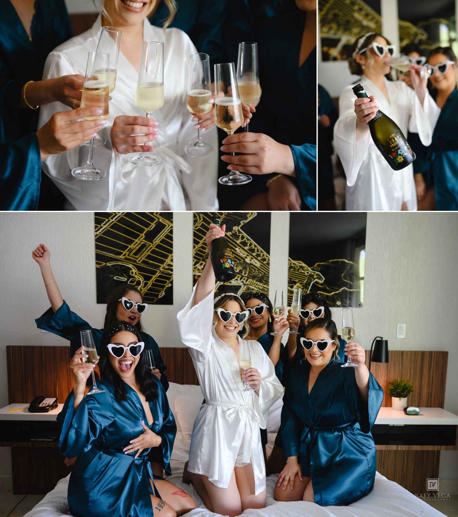 Bridesmaids in teal satin robes celebrate with champagne glasses and heart sunglasses in a hotel room.