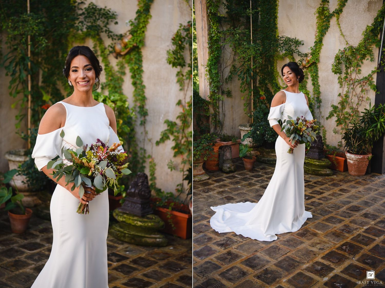 Bride in white cold-shoulder gown holding colorful bouquet, posing in ivy-covered courtyard with terracotta pots.
