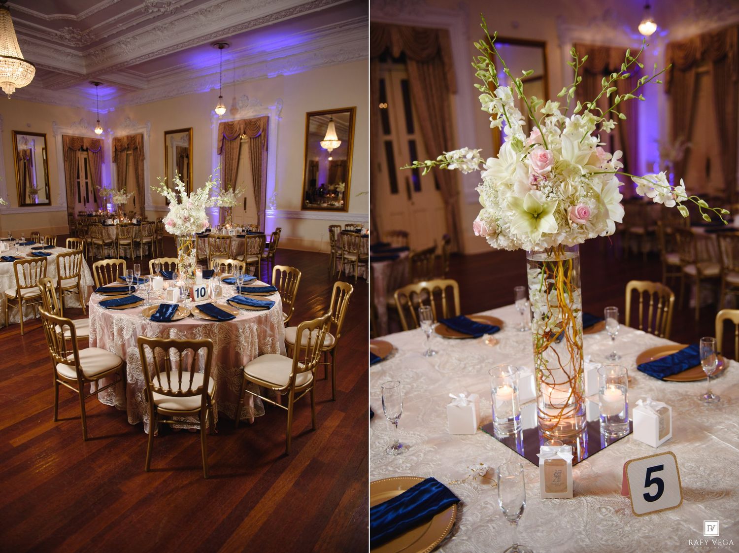 Elegant wedding reception hall with gold chiavari chairs, white floral centerpieces, navy blue napkins, and candlelit tables.