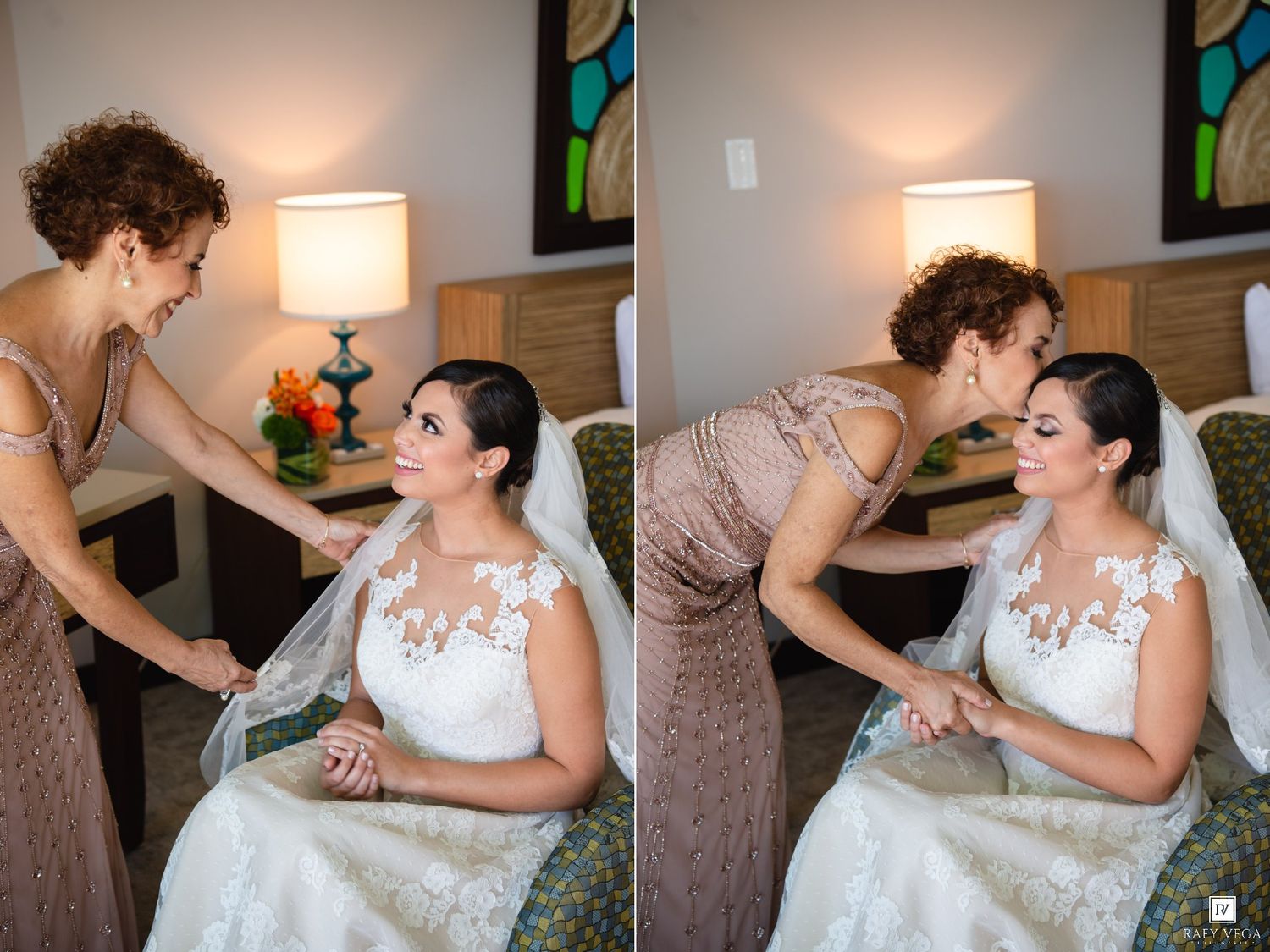 Bride in white lace gown sits as older woman helps with veil and shares a tender moment before the wedding ceremony.
