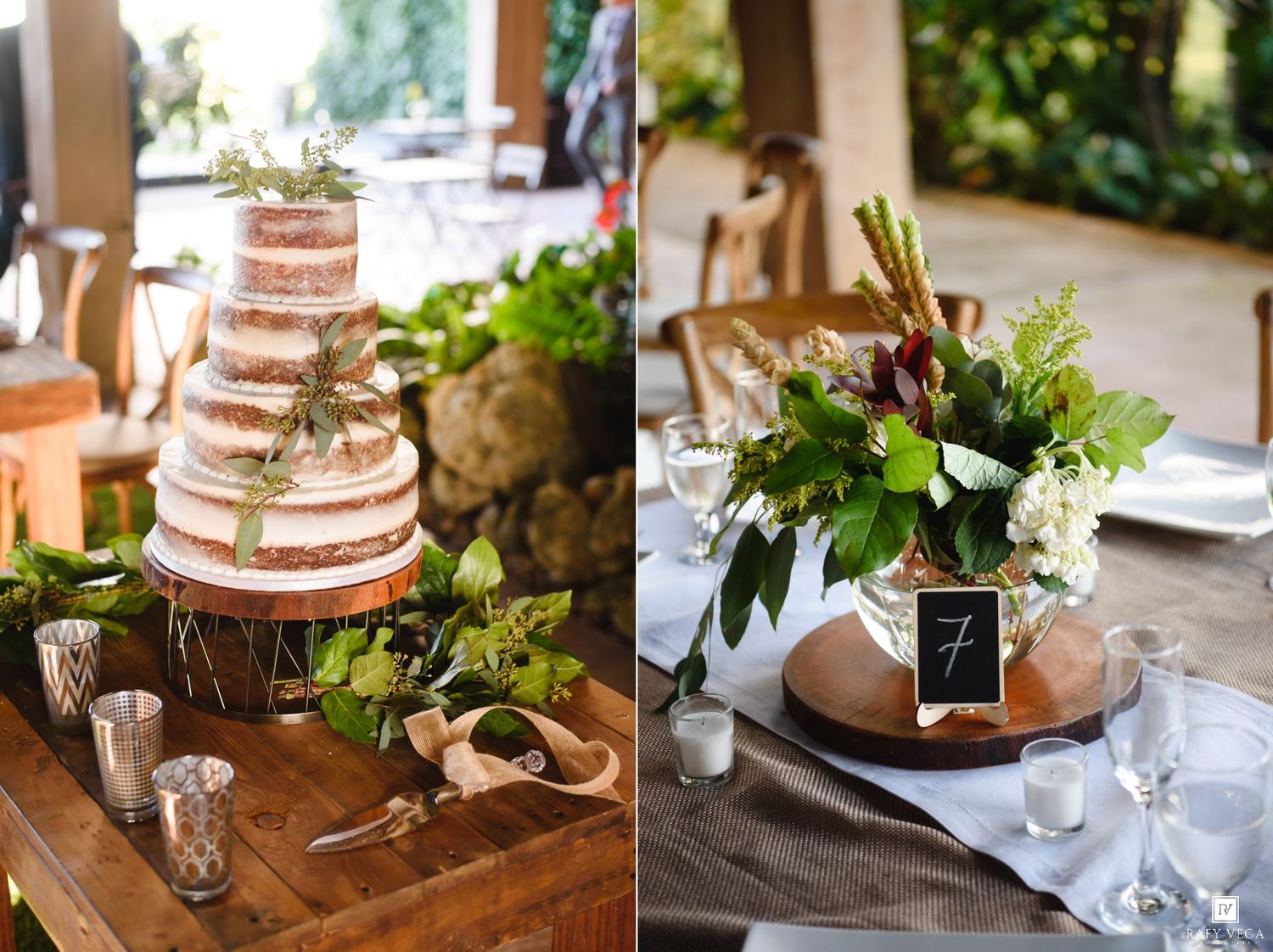 Naked wedding cake with greenery beside a rustic floral centerpiece with chalkboard table number on wooden slice.