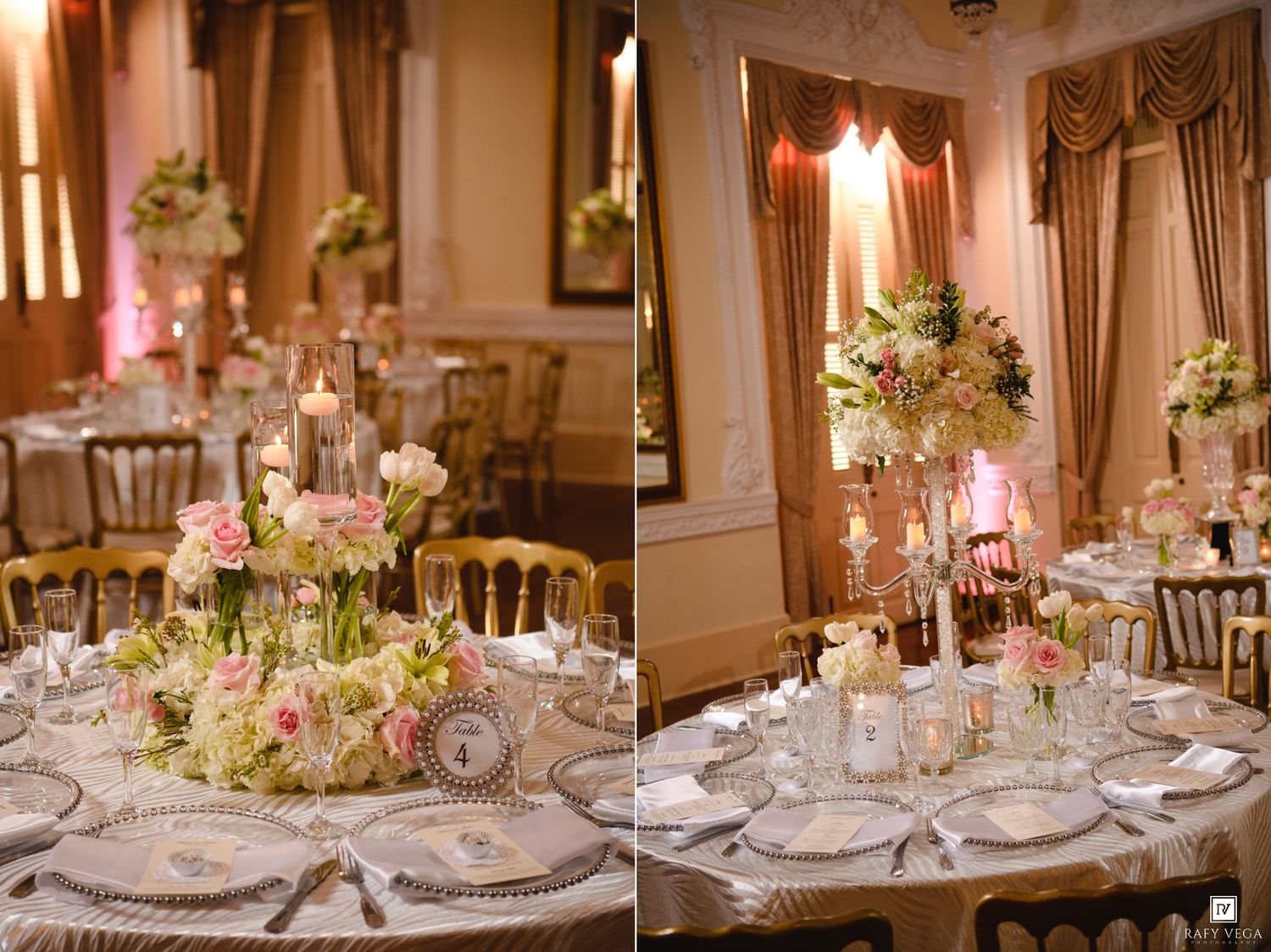 Elegant wedding reception tables adorned with tall floral centerpieces of pink and white roses in a grand ballroom.