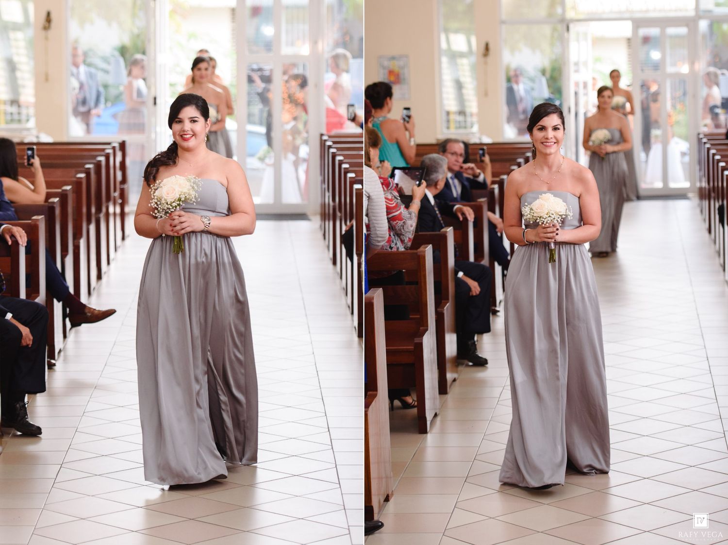 Bridesmaid in silver gown walks down church aisle holding white bouquet during wedding ceremony.