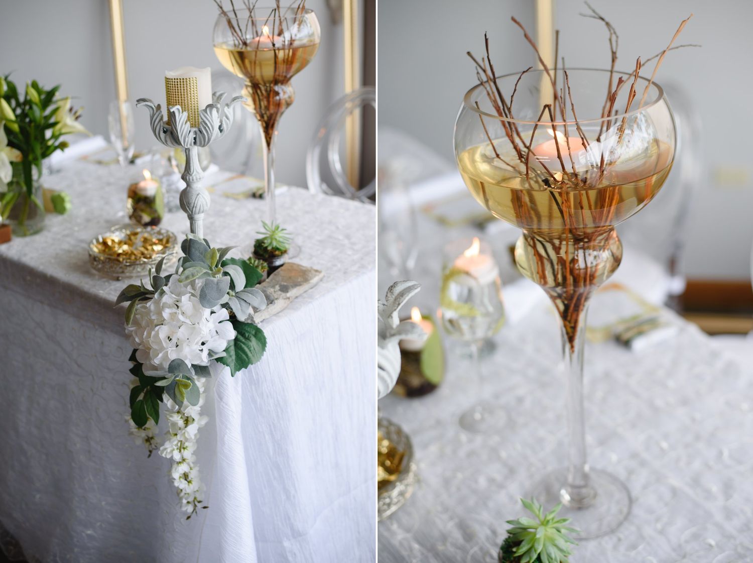 Elegant wedding table centerpieces featuring tall glass vases with branches, white hydrangeas, and gold candle holders.