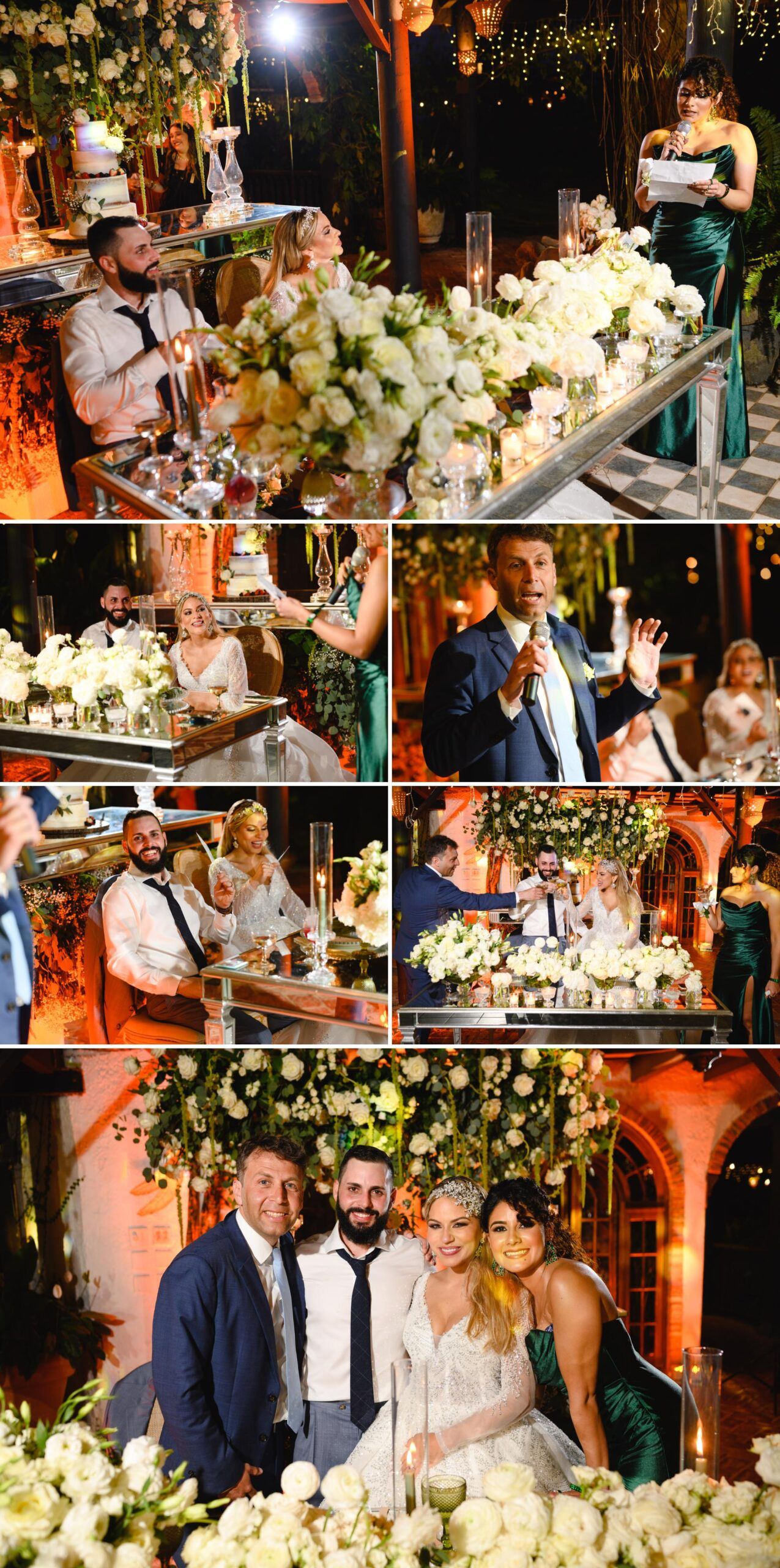 Elegant wedding reception with white floral arrangements, candlelight, and guests celebrating at a beautifully decorated head table.