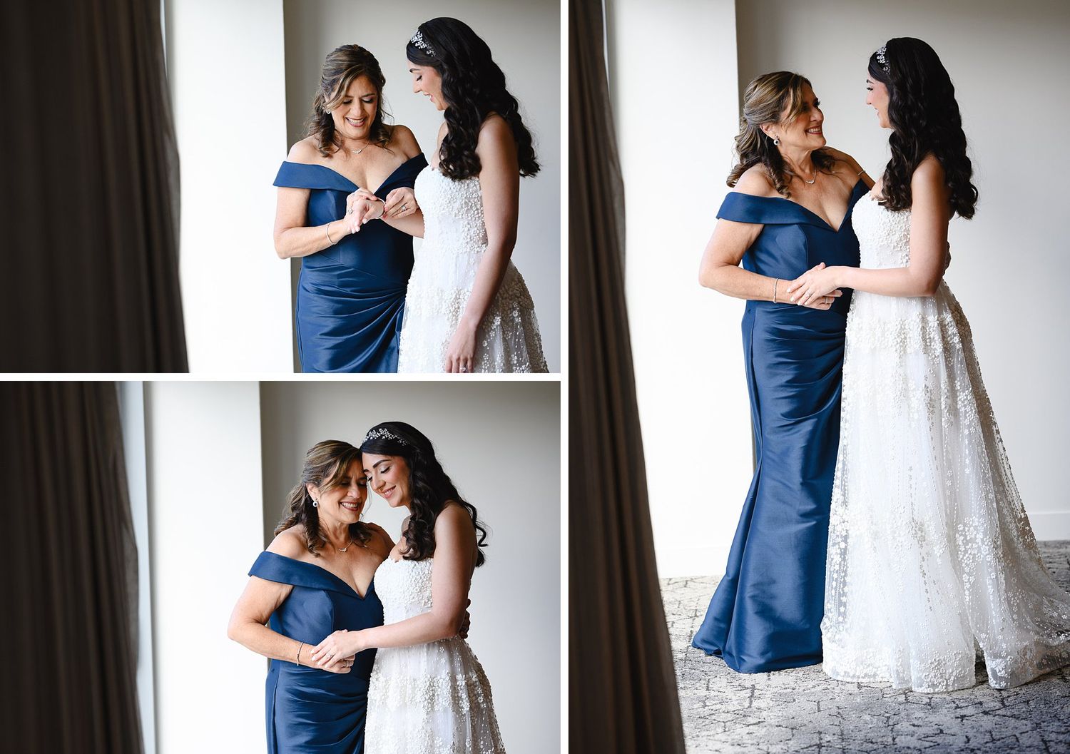Bride in white lace gown with mother in navy blue off-shoulder dress sharing a tender moment before the wedding ceremony.
