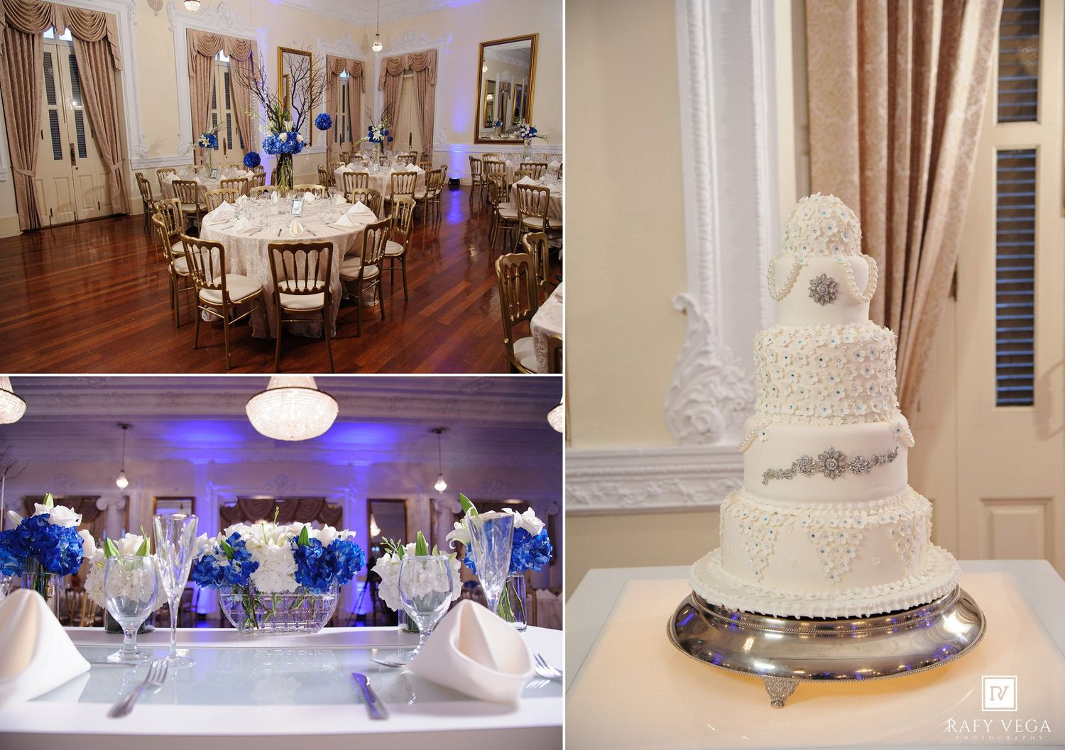 Elegant wedding venue with round tables, blue floral centerpieces, gold chairs, and a multi-tiered white lace wedding cake.