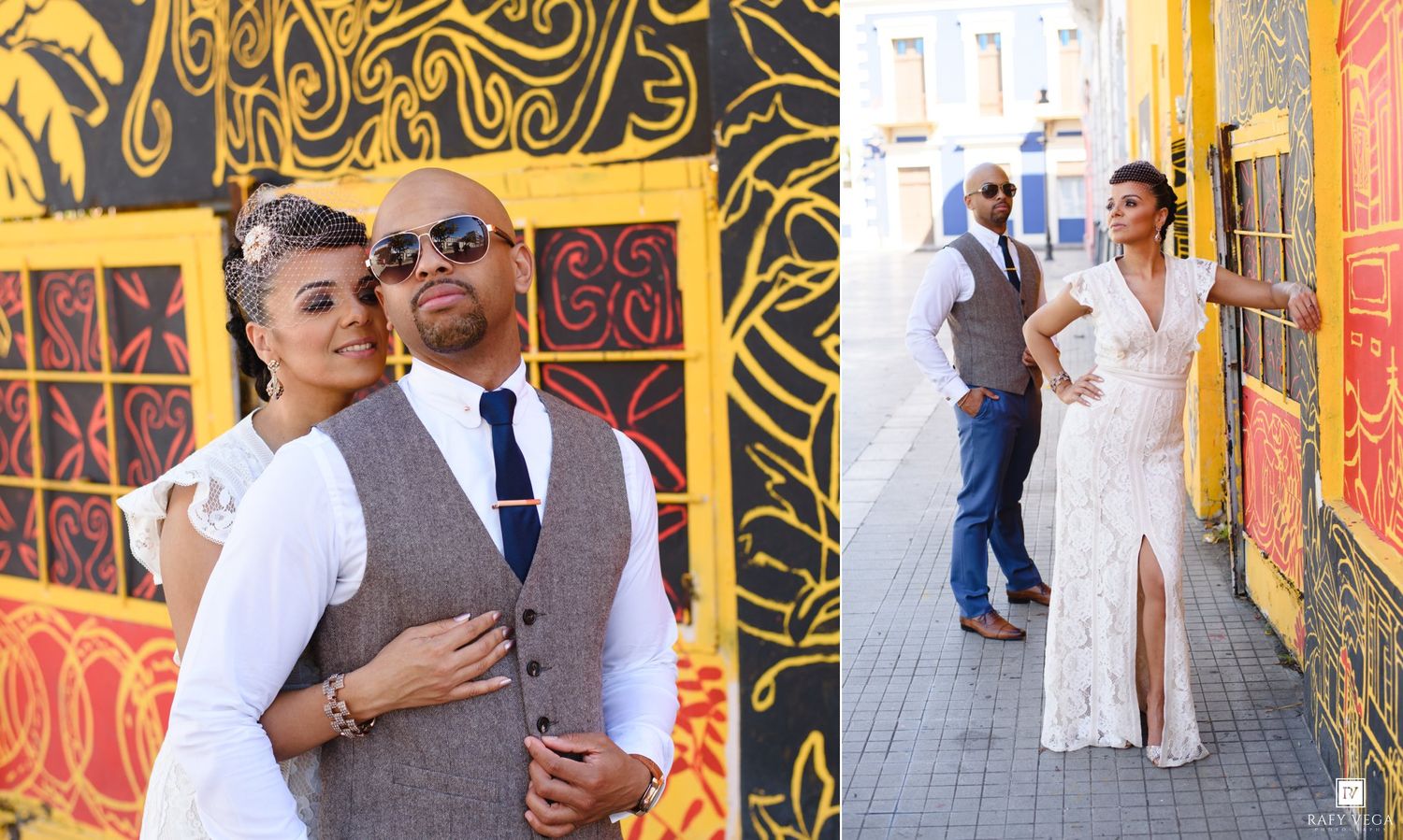 Couple poses in front of vibrant yellow mural, bride in white lace gown and groom in gray vest with tie.