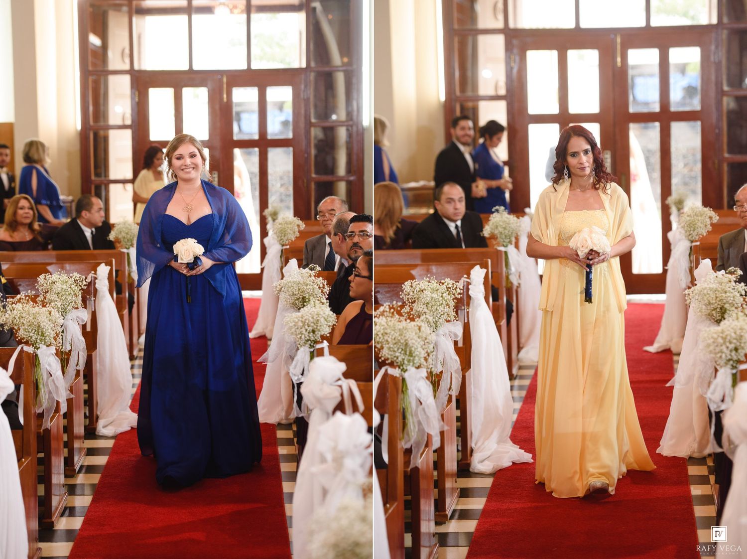 Two bridesmaids walk down a red carpet aisle in a church, one in blue and one in yellow gowns.