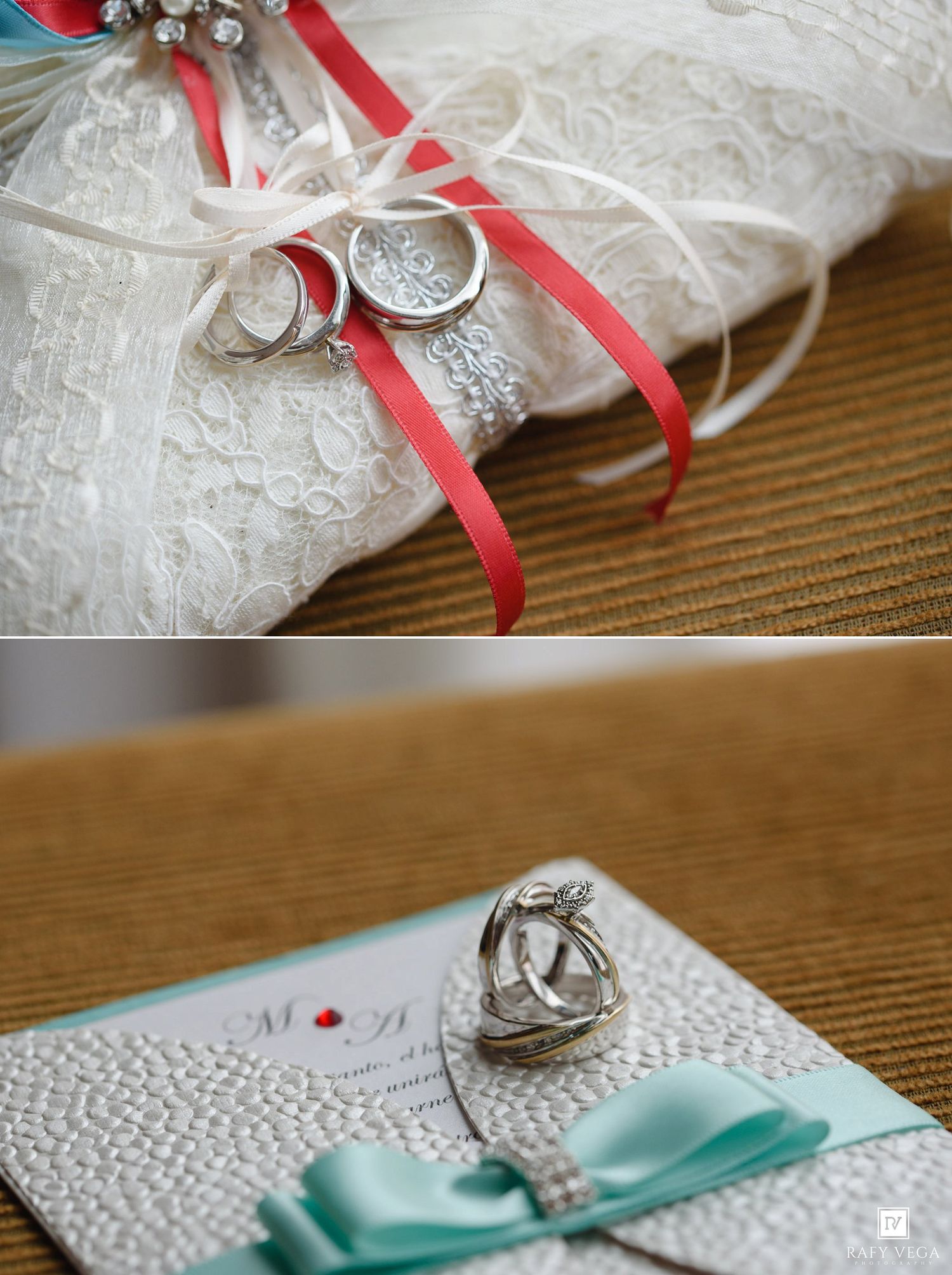 Wedding rings on lace pillow with red ribbon and mint green invitation card with bow.