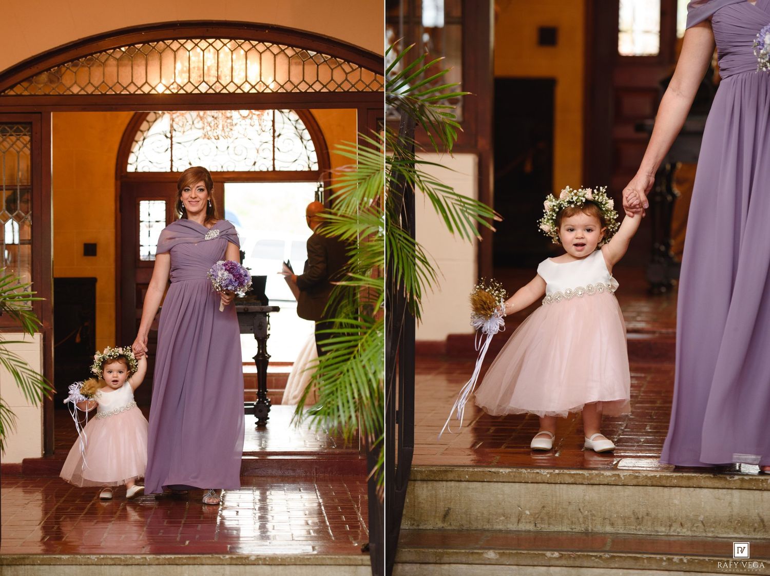 Adorable flower girl in white dress holds bridesmaid hand at wedding ceremony entrance.