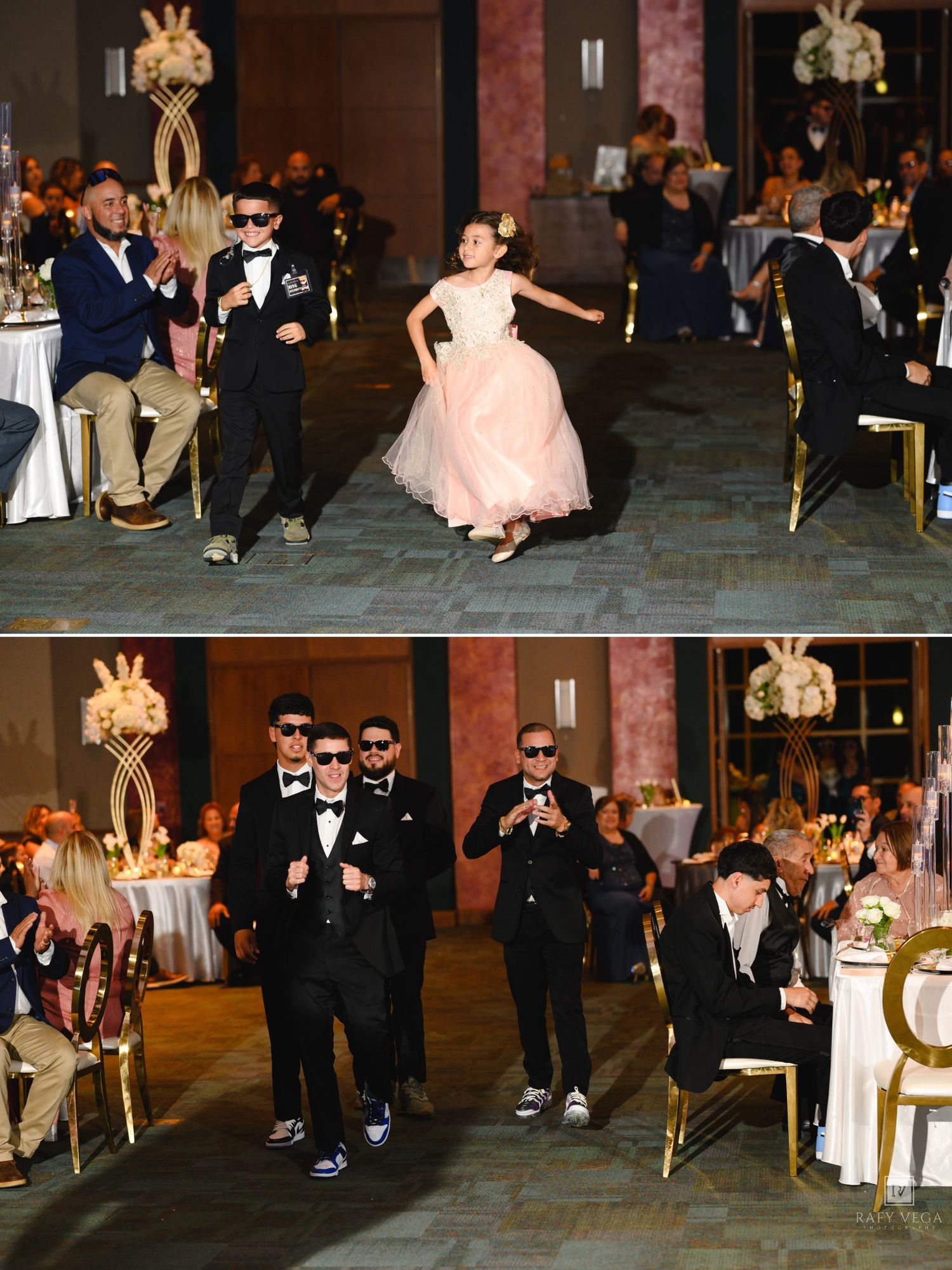 Children in formal attire dance at a wedding reception, with a girl in a pink gown and boys in black tuxedos with sunglasses.