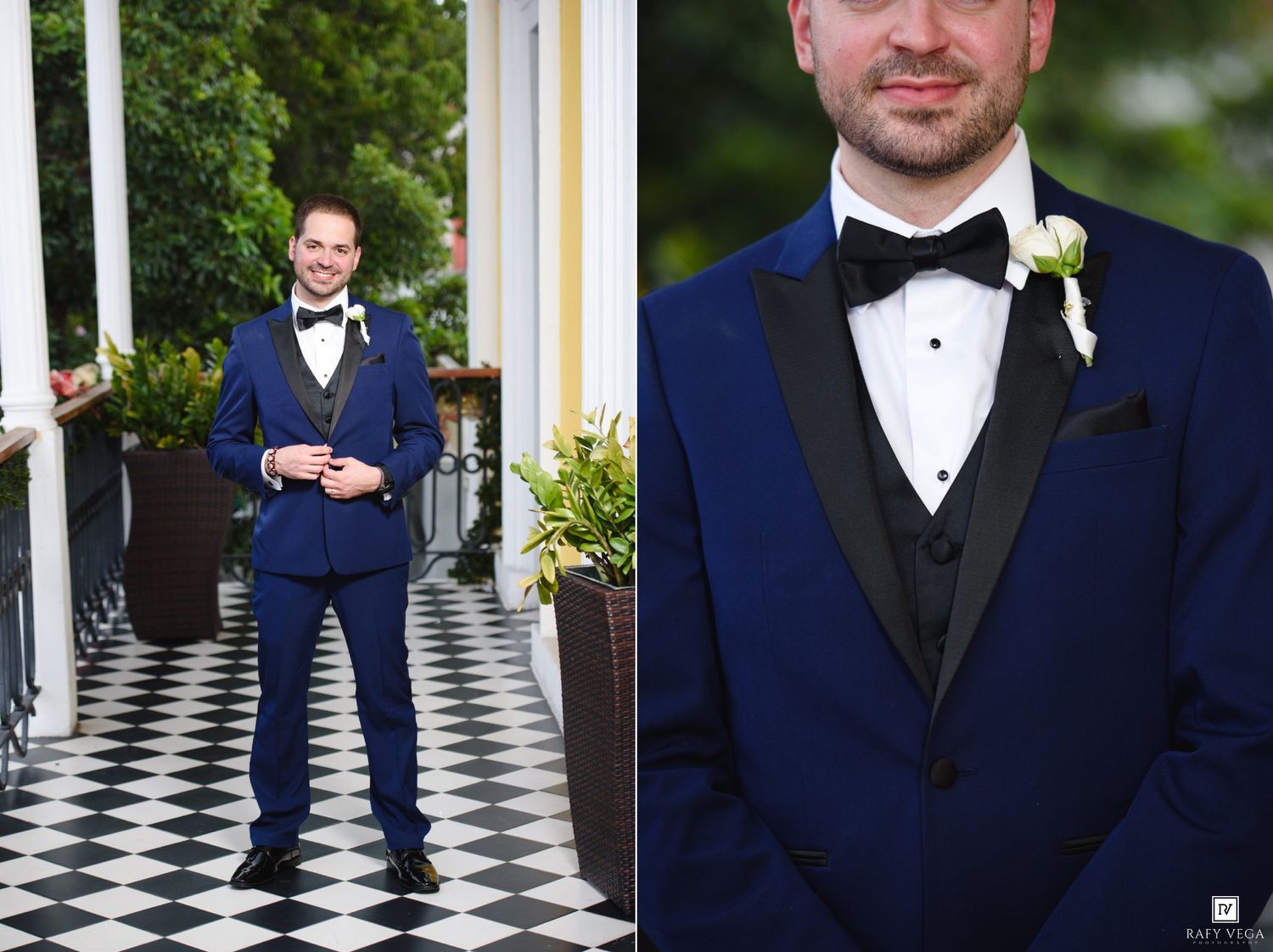 Groom in navy blue tuxedo with black lapels and white boutonniere posing on checkered porch at wedding.