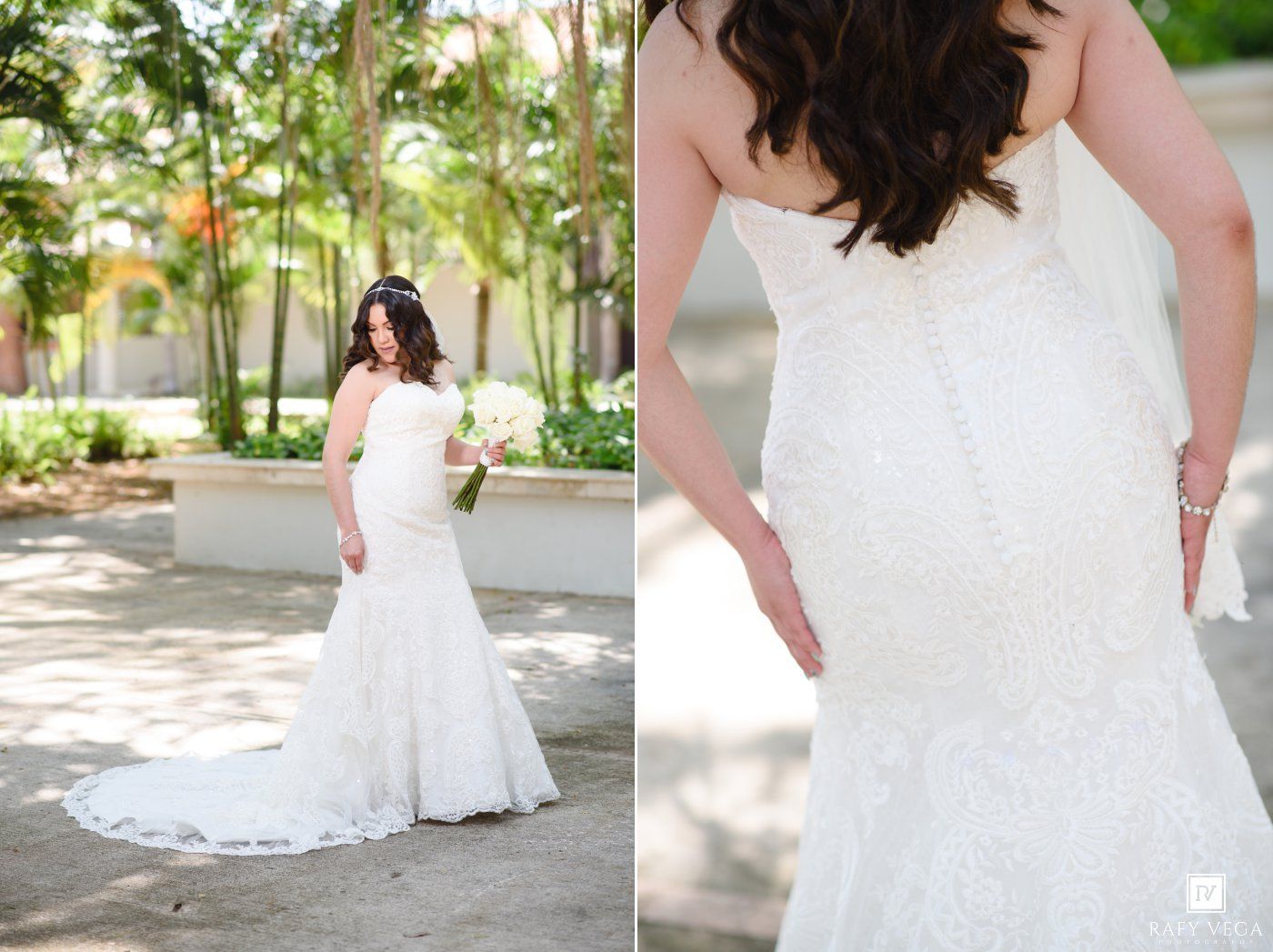Bride in strapless lace mermaid wedding dress with train posing outdoors in garden setting.