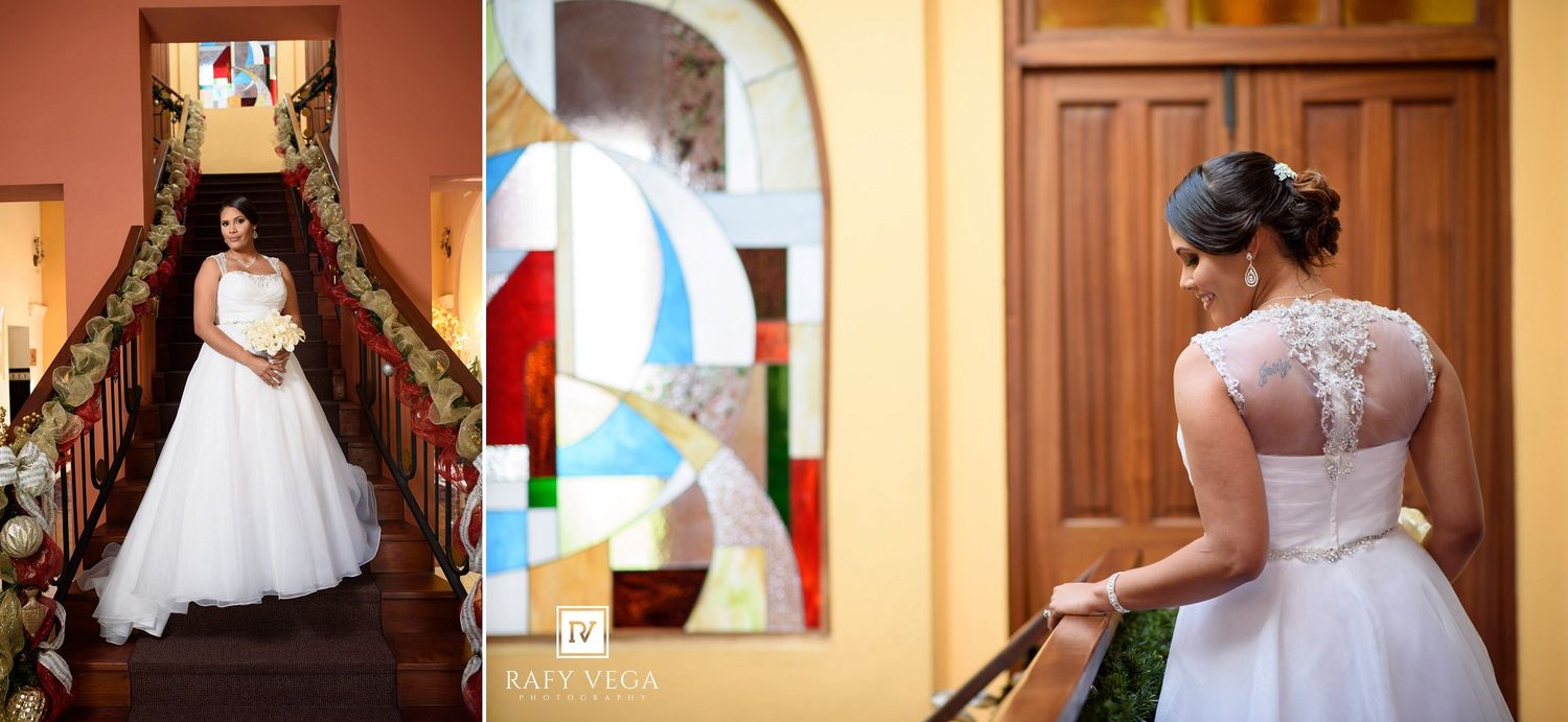 Bride in white ball gown poses on staircase and near stained glass window in elegant venue.