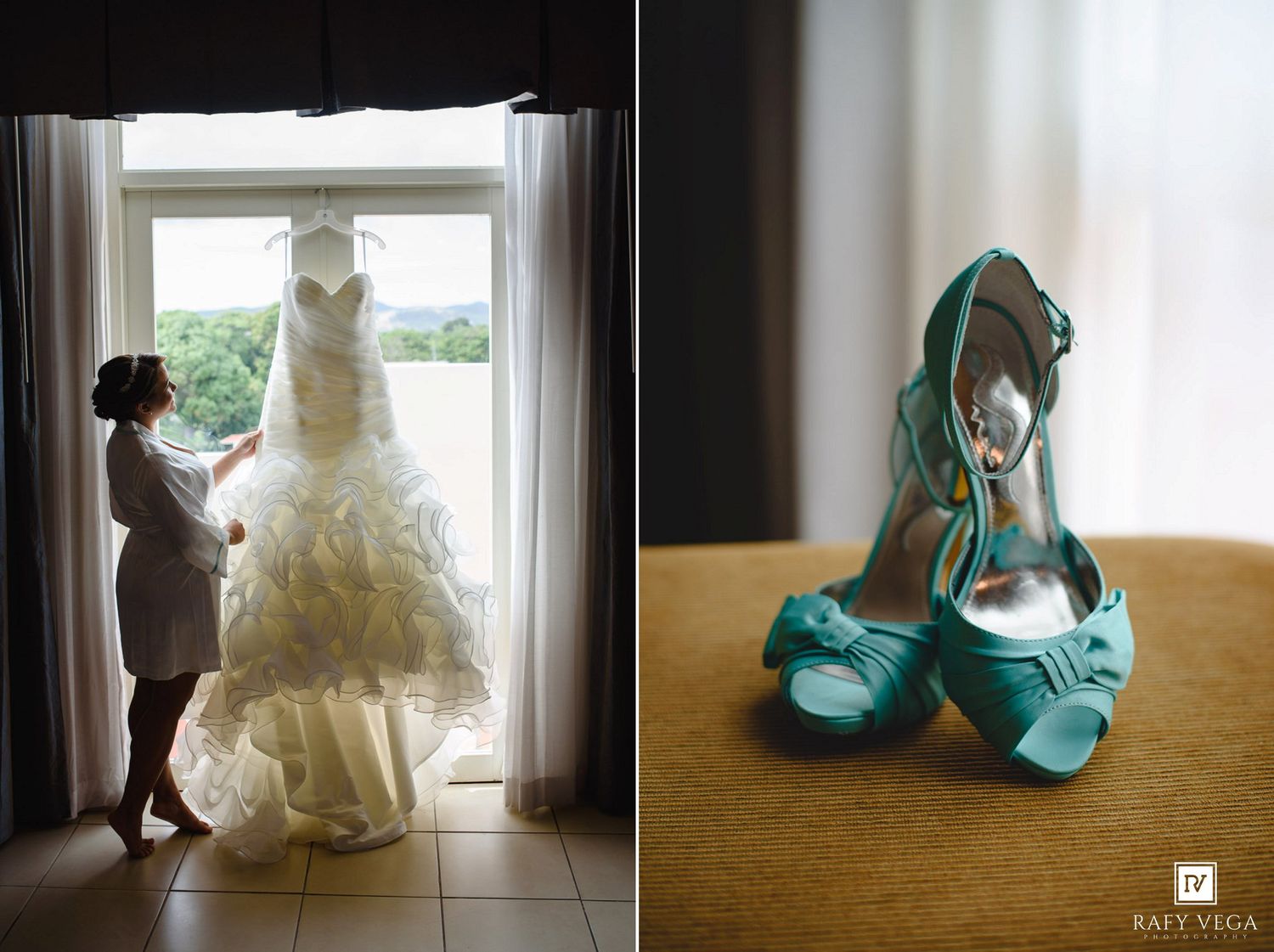 Bride admiring her strapless wedding gown hanging by a window beside teal bow-adorned high heel shoes.
