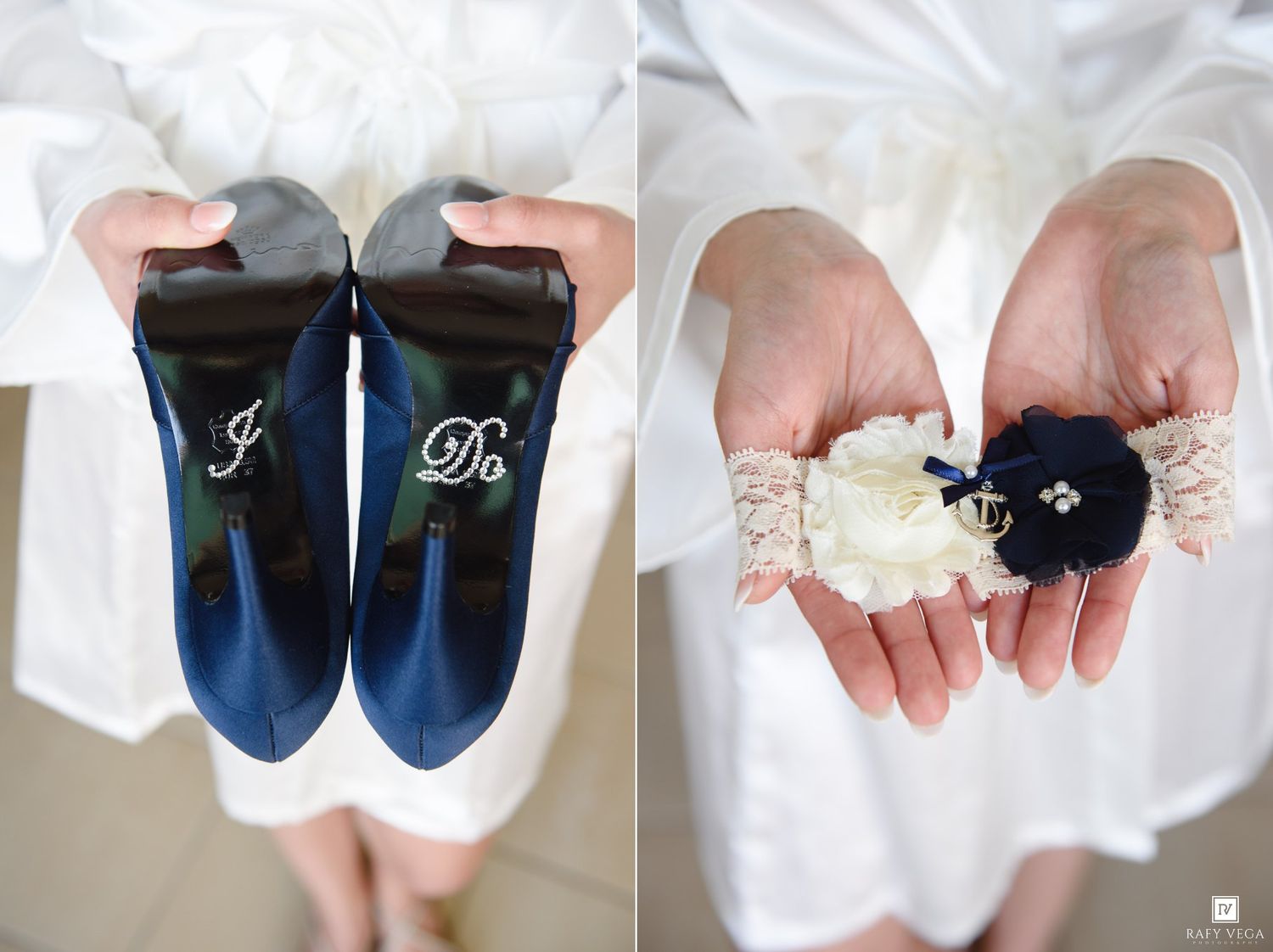 Bride holding navy blue wedding shoes with I Do written on soles beside a lace garter with navy flower.