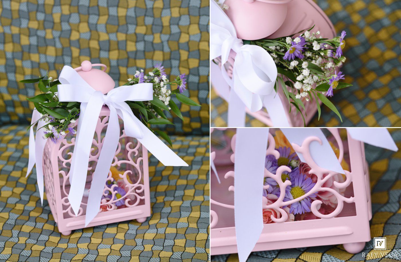 Pink decorative birdcage gift box adorned with white ribbon bow and fresh wildflowers, perfect for weddings or special occasions.