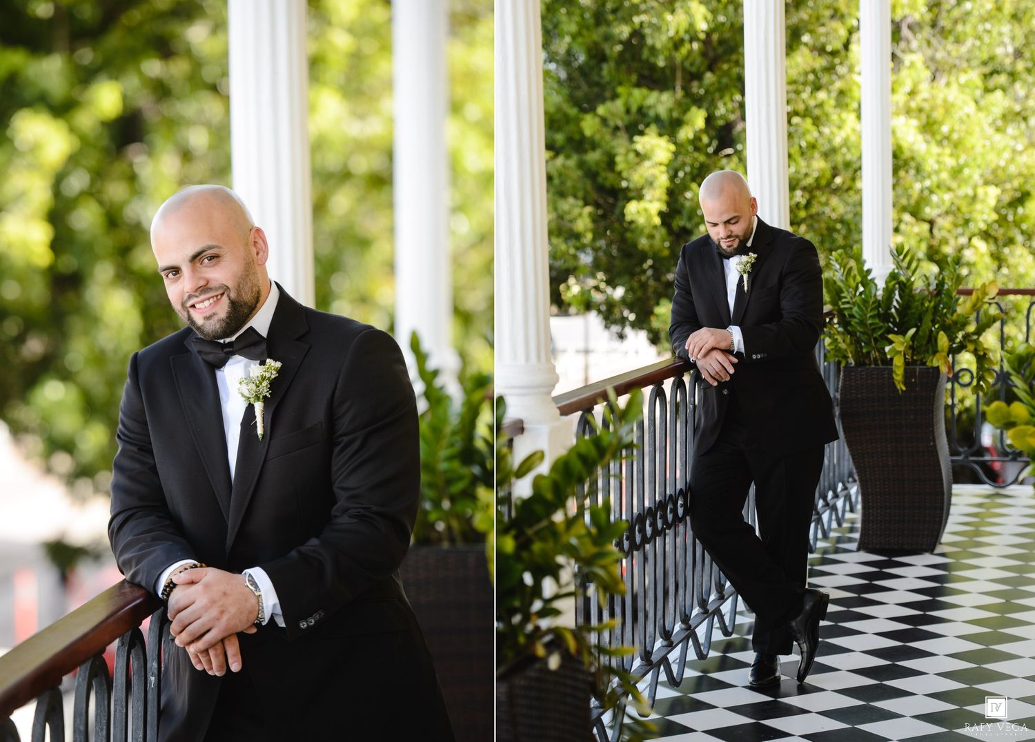 Dapper groom in black tuxedo with boutonniere poses on elegant venue porch with checkered floors and white columns.
