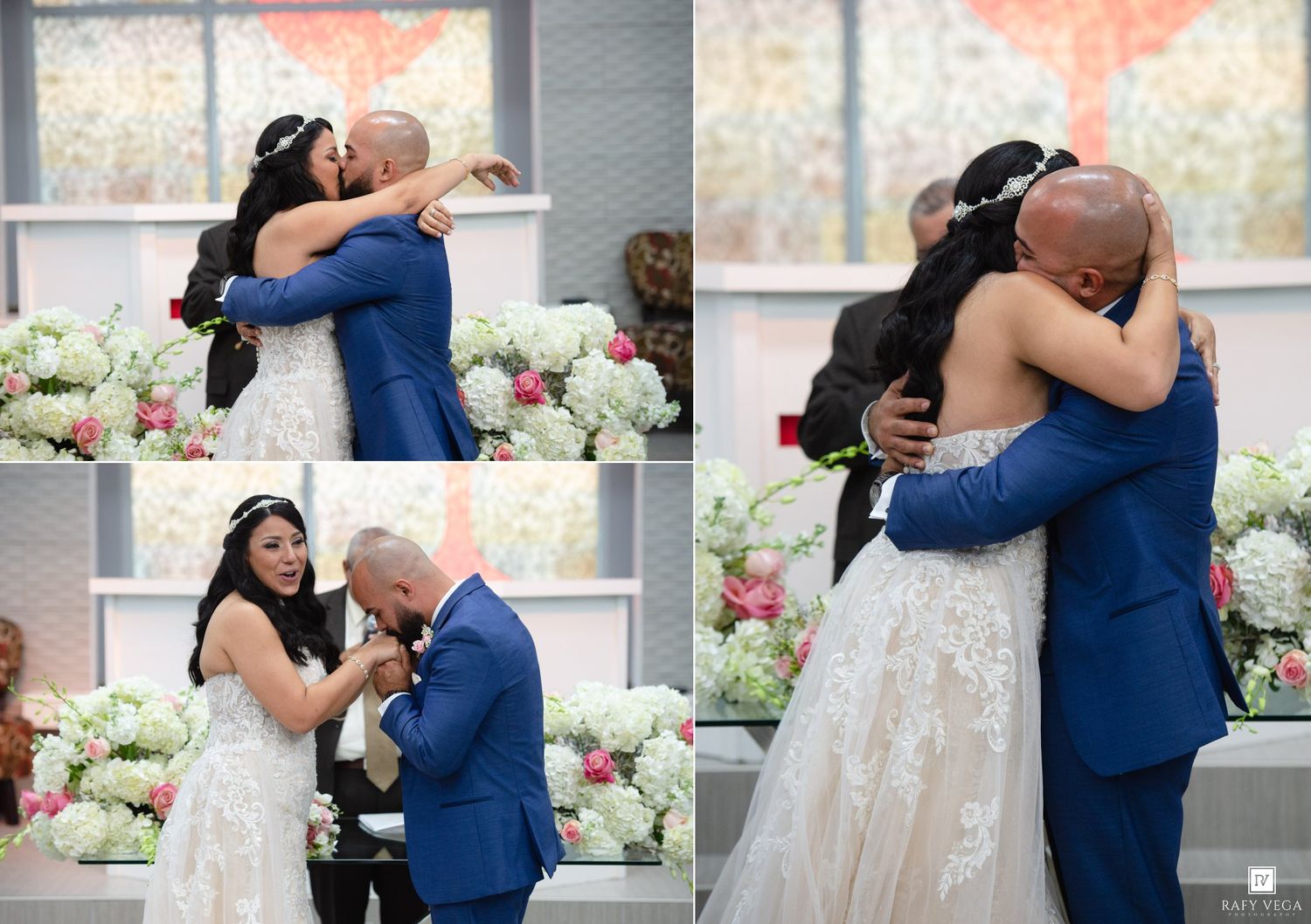 Bride and groom share an emotional first look hug during wedding ceremony with floral backdrop.