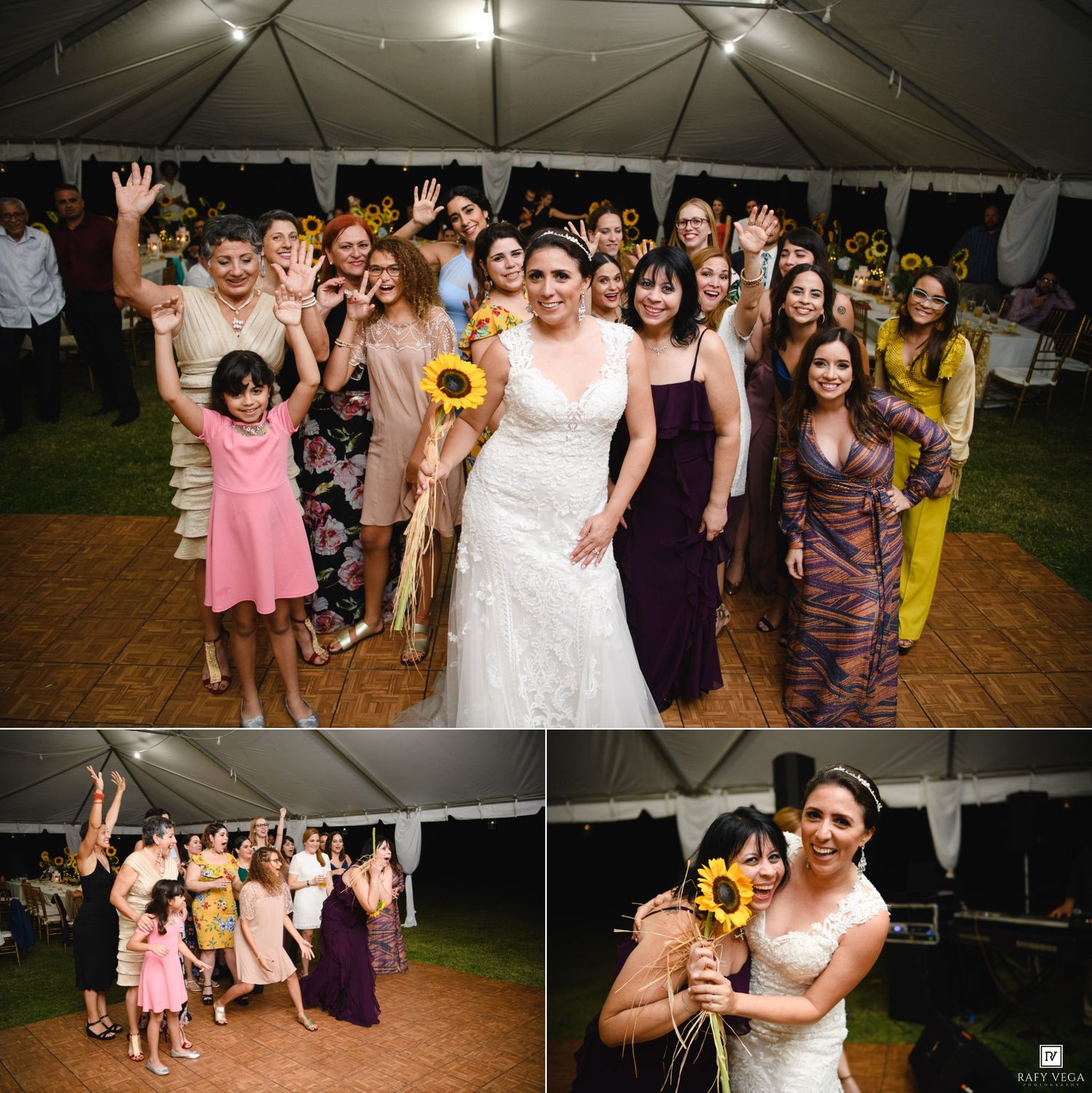 Bride in white gown poses with female wedding guests under tent, holding sunflowers, celebrating at outdoor reception.