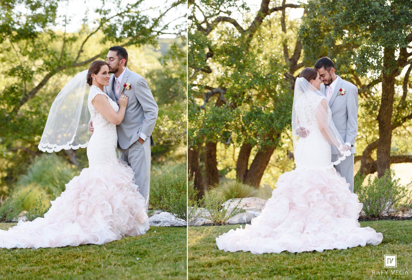 Bride in blush ruffled mermaid gown with veil and groom in gray suit pose outdoors at garden wedding.