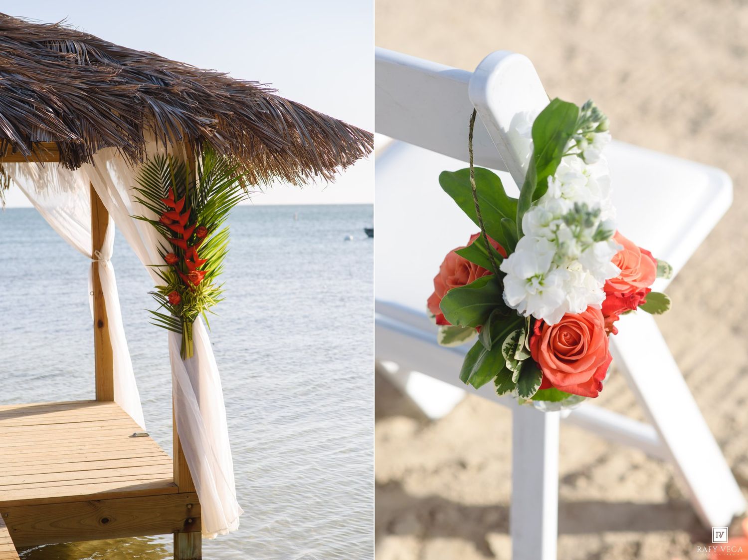 Beach wedding setup with tropical floral arch and white chair adorned with coral roses and white blooms by the ocean.