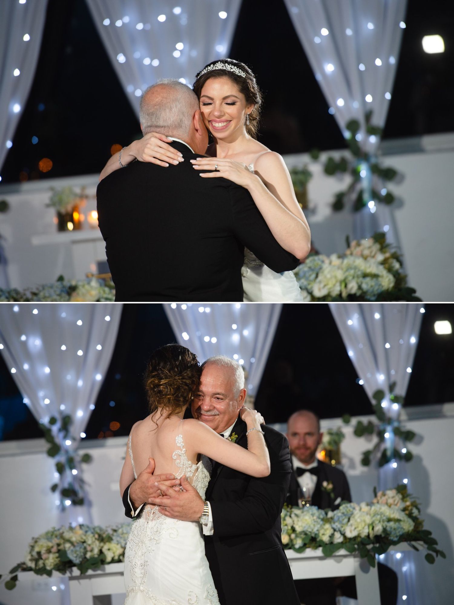 Bride smiling warmly while embracing an older man in a tuxedo during an elegant wedding reception with fairy lights.