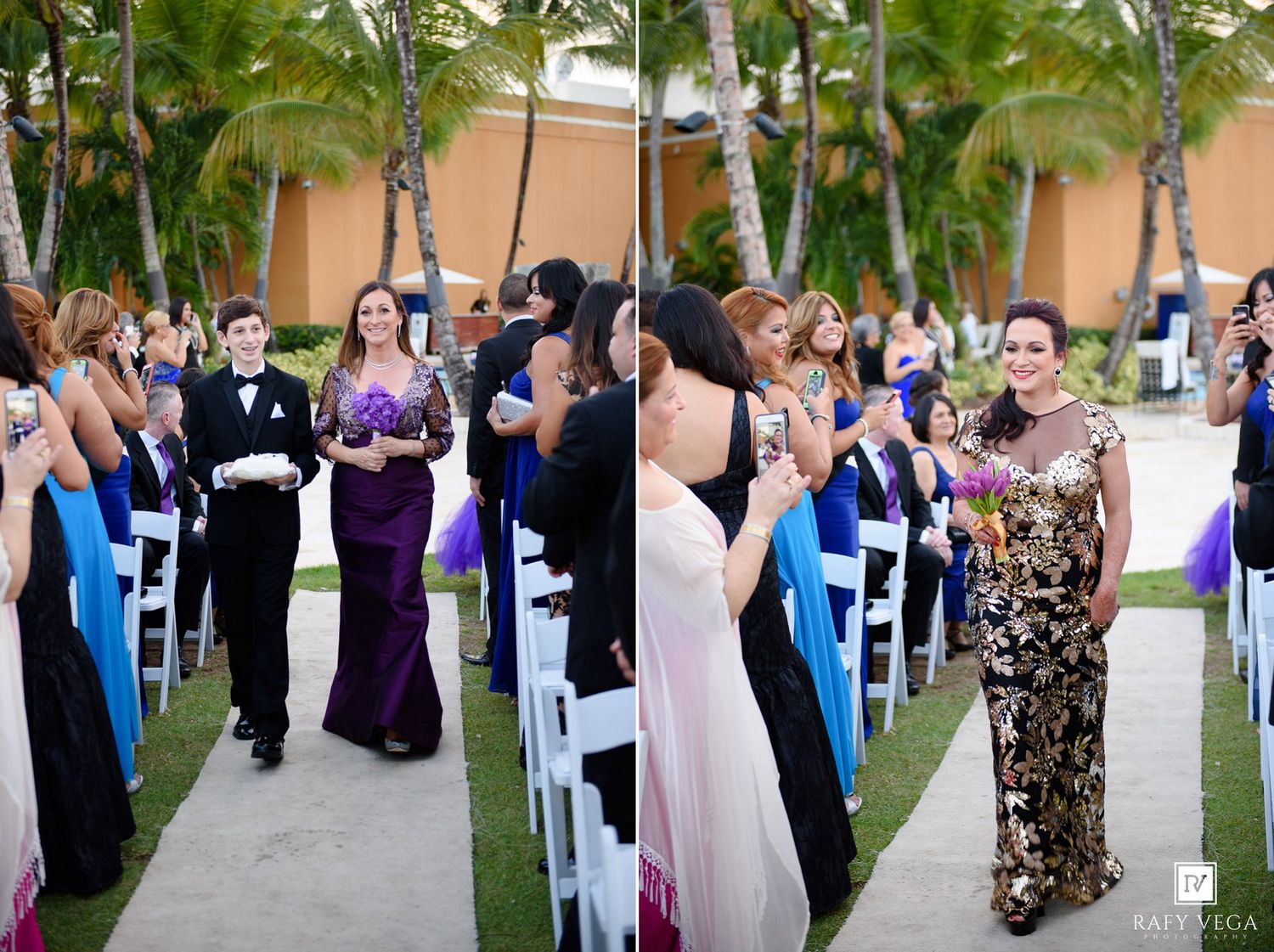 Bridesmaids in purple and gold dresses walk down outdoor wedding aisle lined with white chairs and palm trees.
