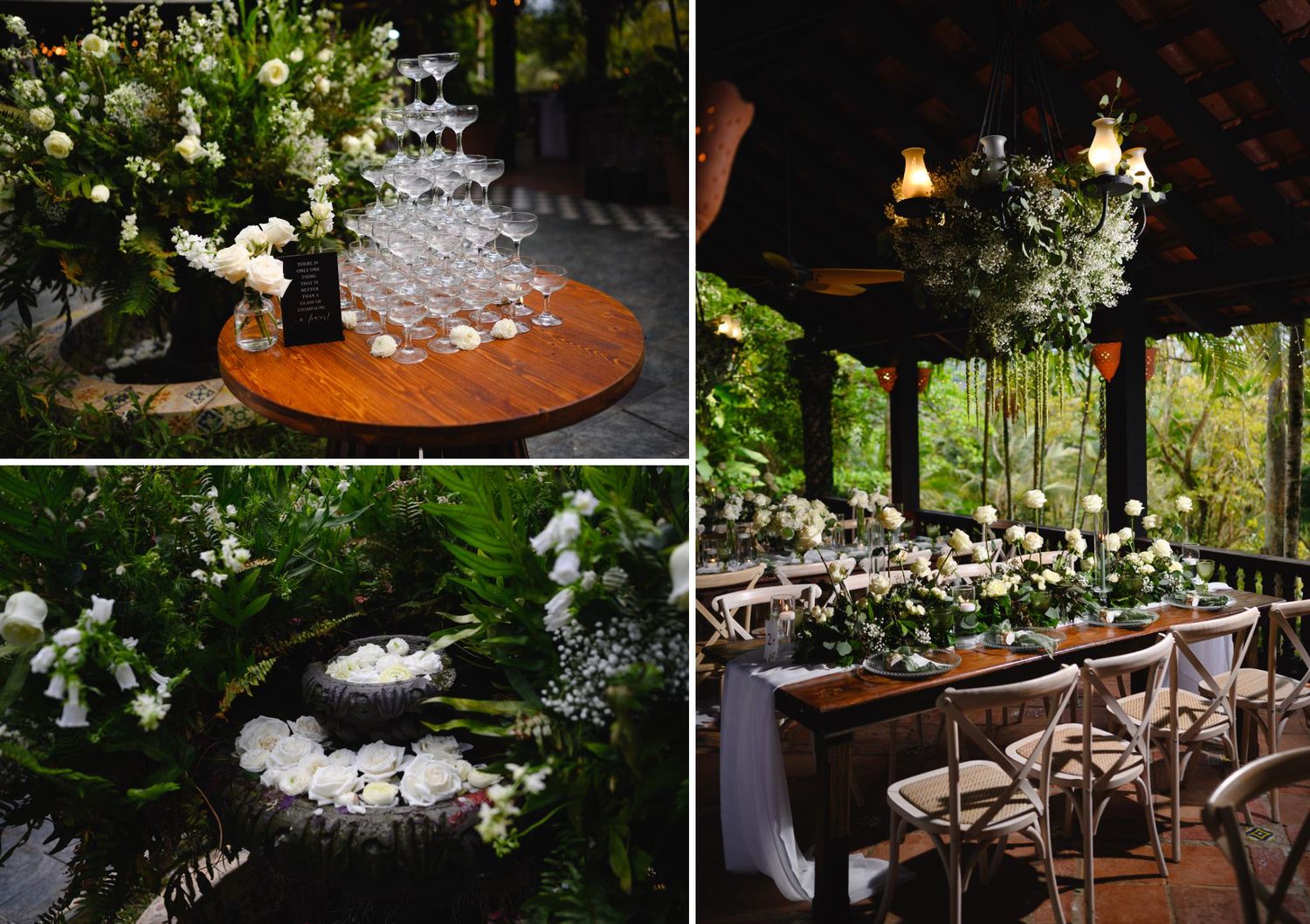 Elegant wedding reception with white floral arrangements, champagne tower, and rustic wooden tables set in a lush garden venue.