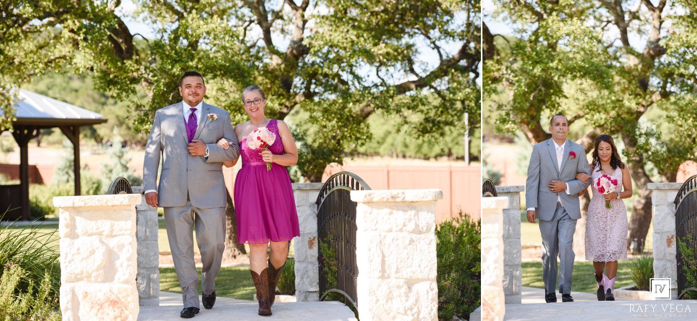 Wedding party walking outdoors, groomsmen in gray suits and bridesmaid in fuchsia dress with cowboy boots.