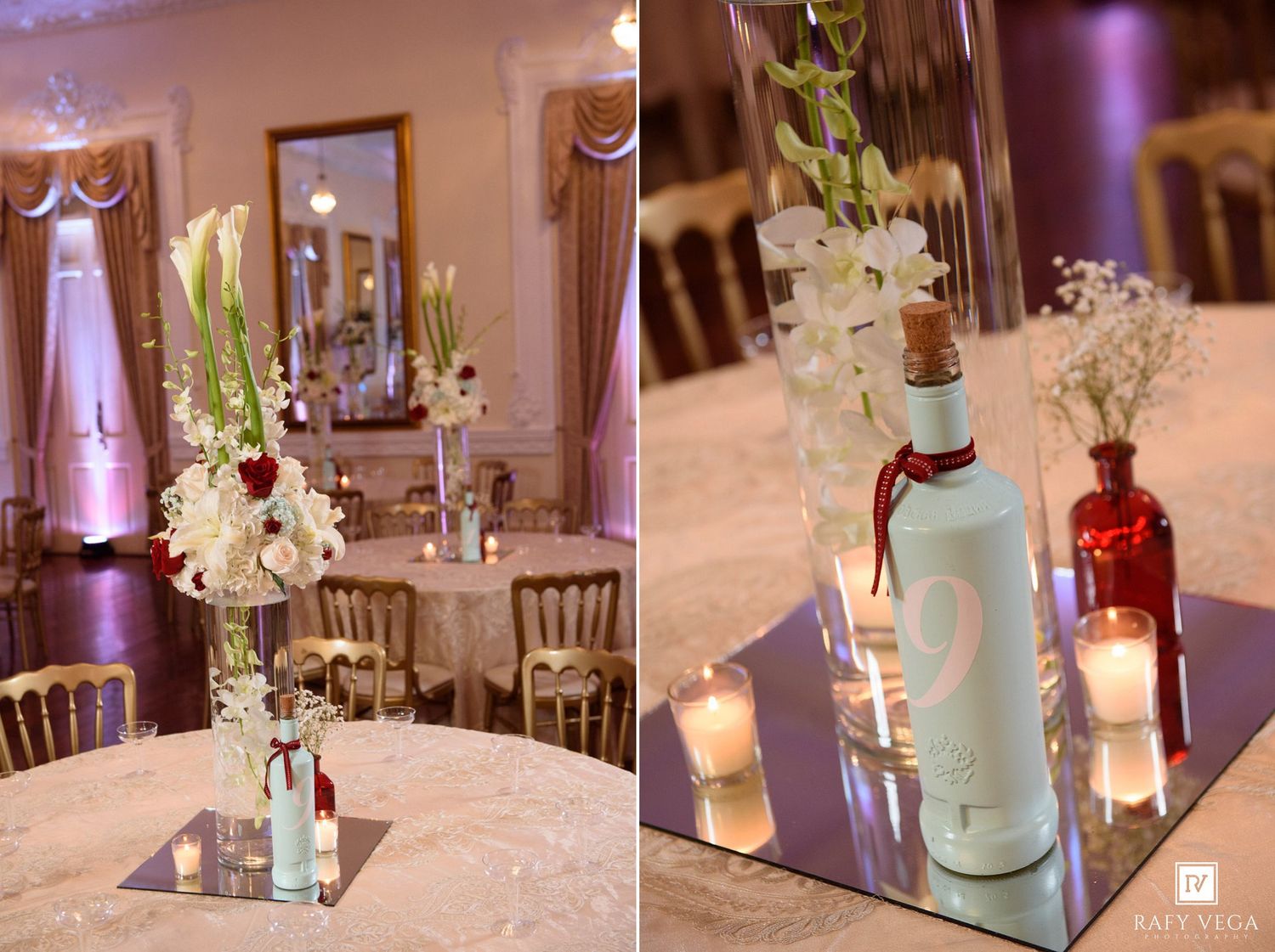 Wedding reception centerpieces featuring tall glass vases with white flowers, candles, and decorative bottles on mirrored trays.