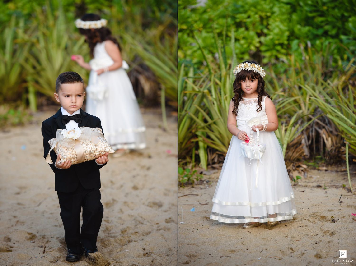 Young ring bearer in tuxedo and flower girl in white dress walk along tropical beach path.