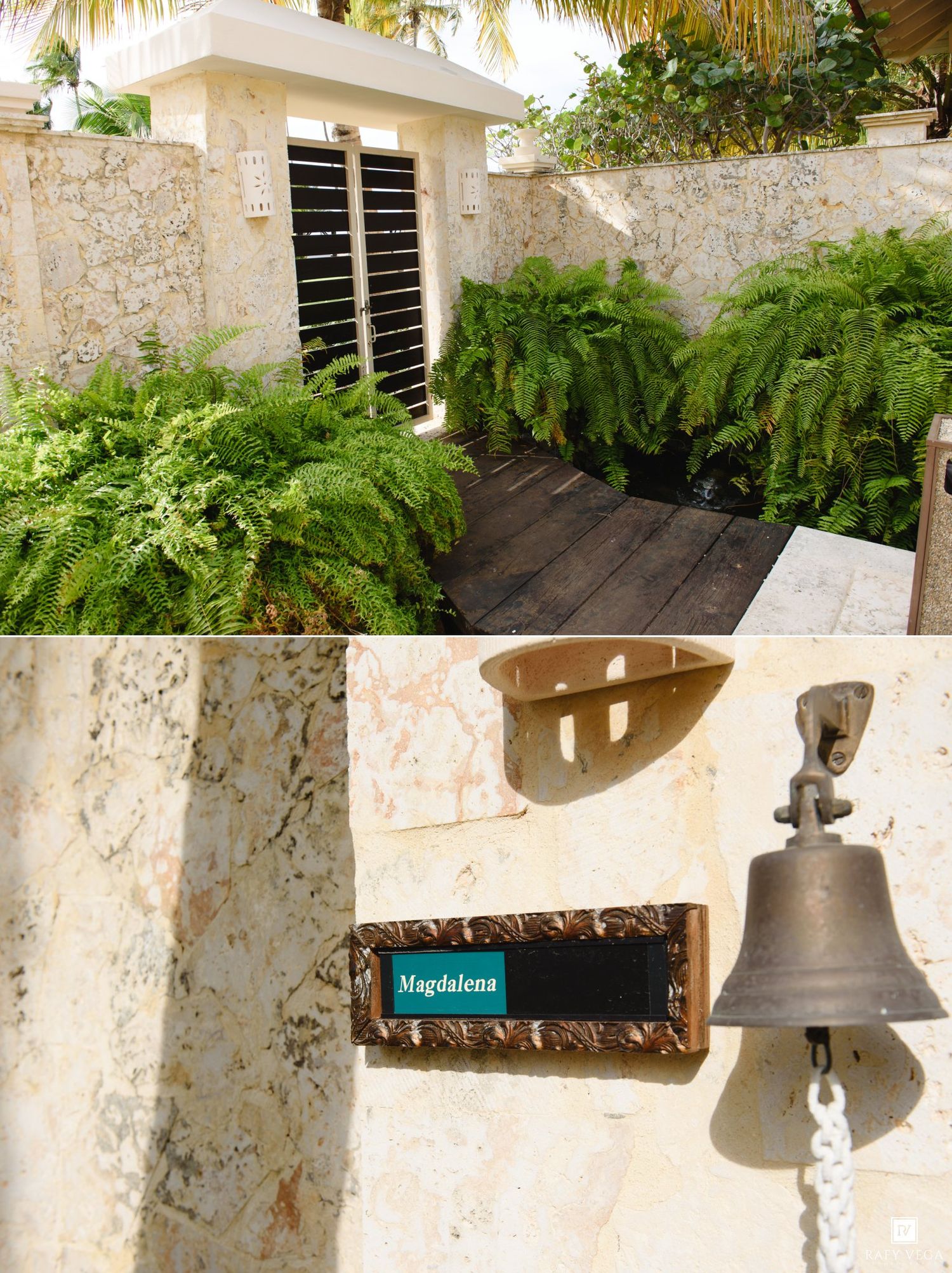 Tropical courtyard with ferns and wooden deck beside a stone wall with a brass bell and Magdalena nameplate.