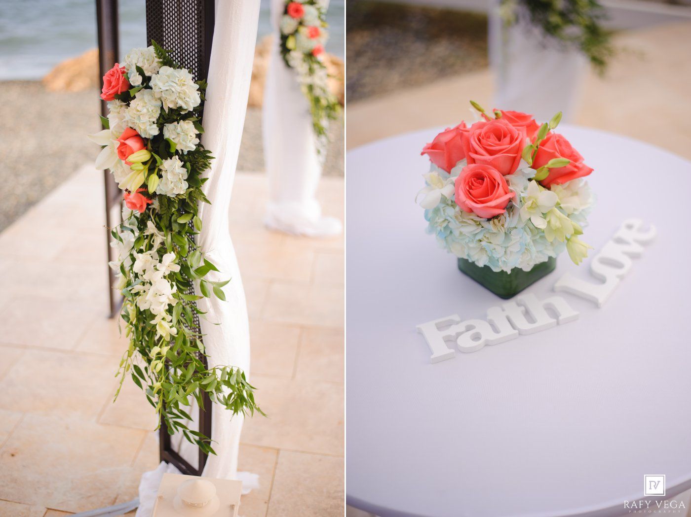 Coral roses and white flowers adorn a wedding arch and centerpiece with a Faith Love sign at a beachside ceremony.