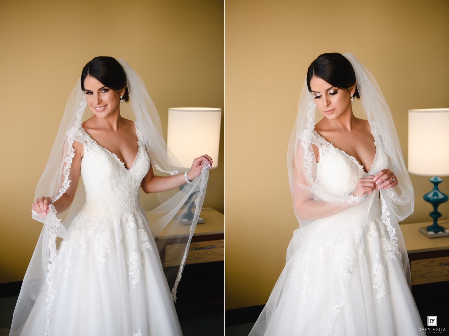 Bride in lace wedding gown and veil posing elegantly in a warmly lit room during bridal preparations.