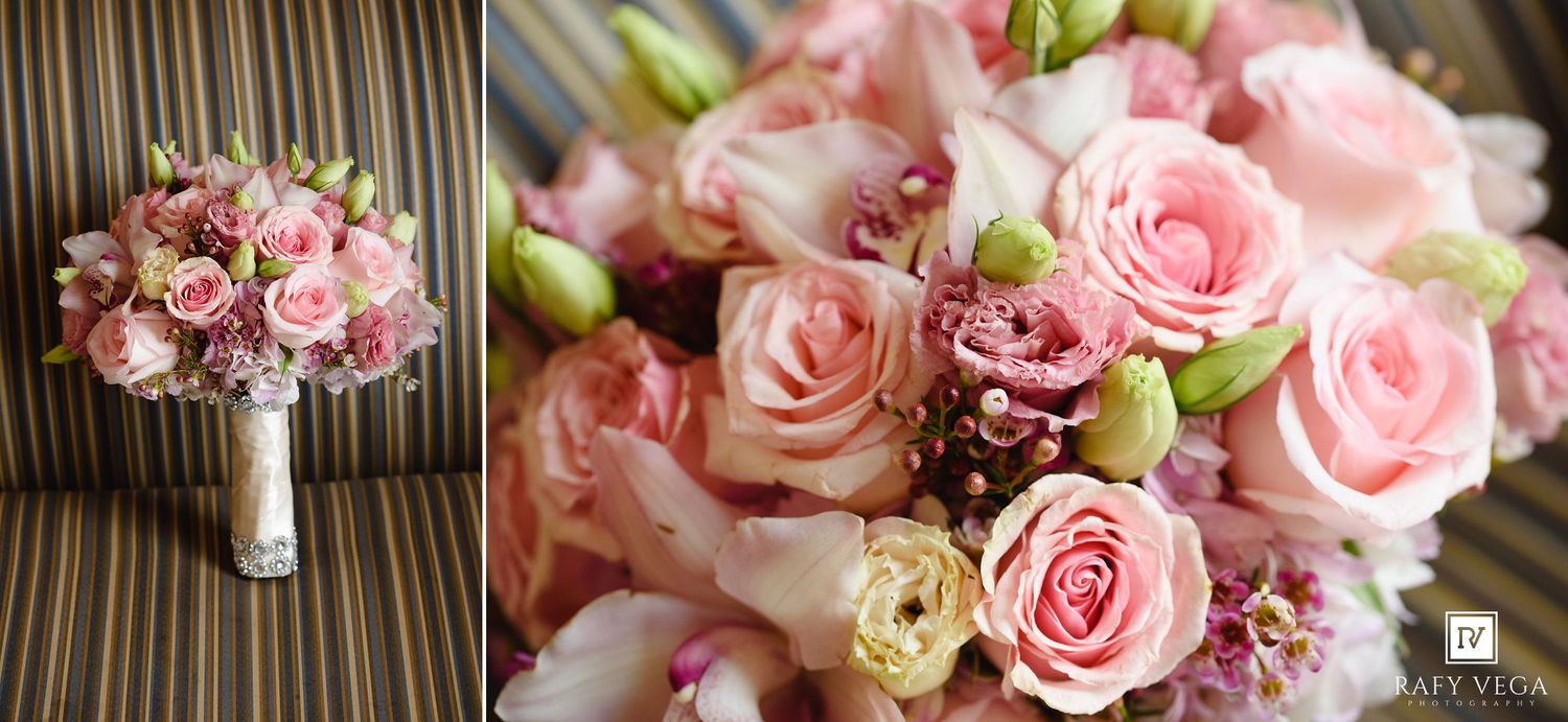 Elegant pink rose wedding bouquet featuring soft blush roses, wax flowers, and green buds arranged for a bridal ceremony.