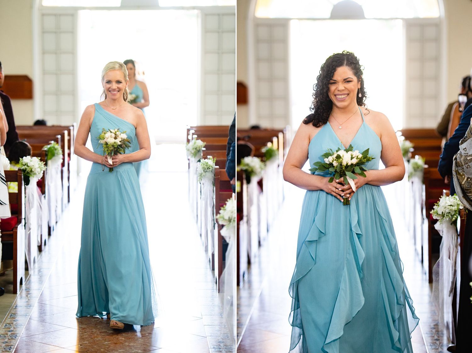 Two bridesmaids in teal blue gowns walk down a church aisle holding white bouquets during a wedding ceremony.