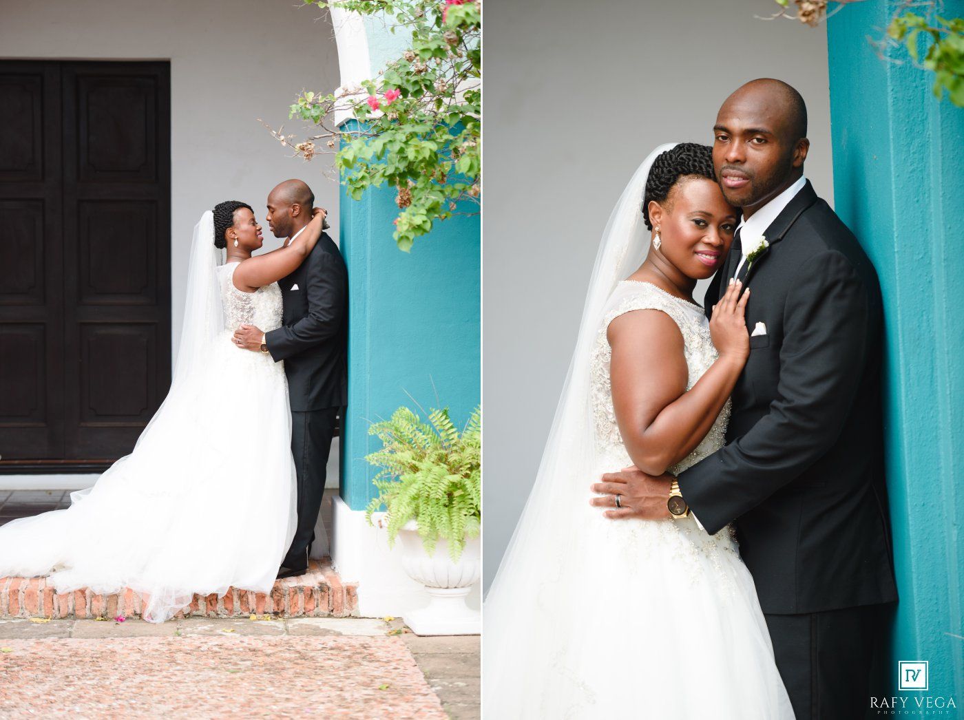 Elegant Black couple in wedding attire pose romantically outside a colorful building, bride in white gown with veil.