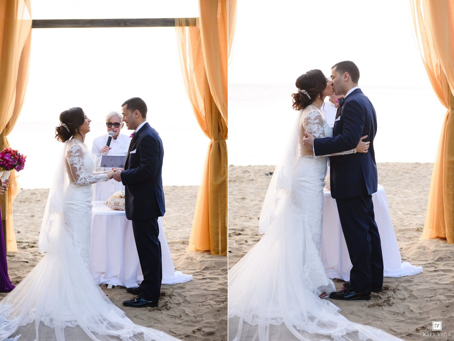 Bride and groom exchange vows and share first kiss at a romantic beach wedding ceremony under a golden draped arch.