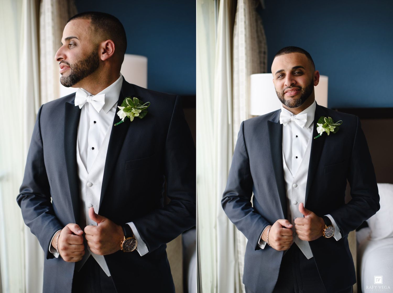 Groom in dark tuxedo with white boutonniere poses confidently before wedding ceremony.