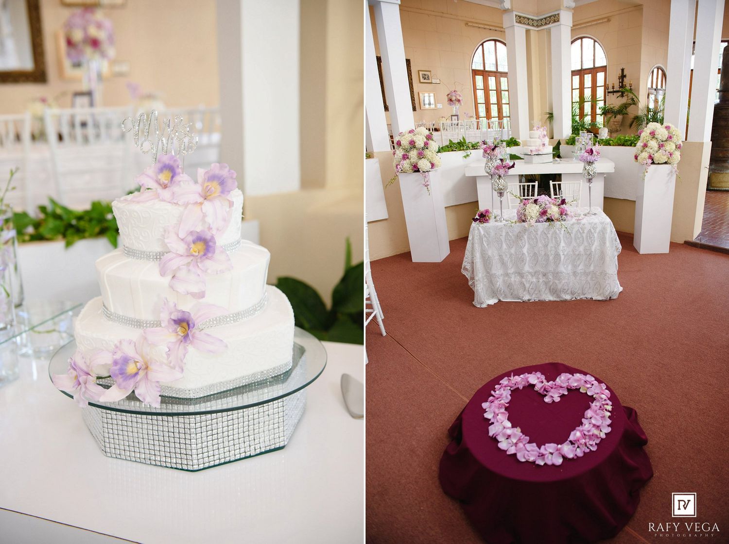 Elegant wedding reception featuring a white tiered cake with purple orchids and a decorated sweetheart table in a bright hall.