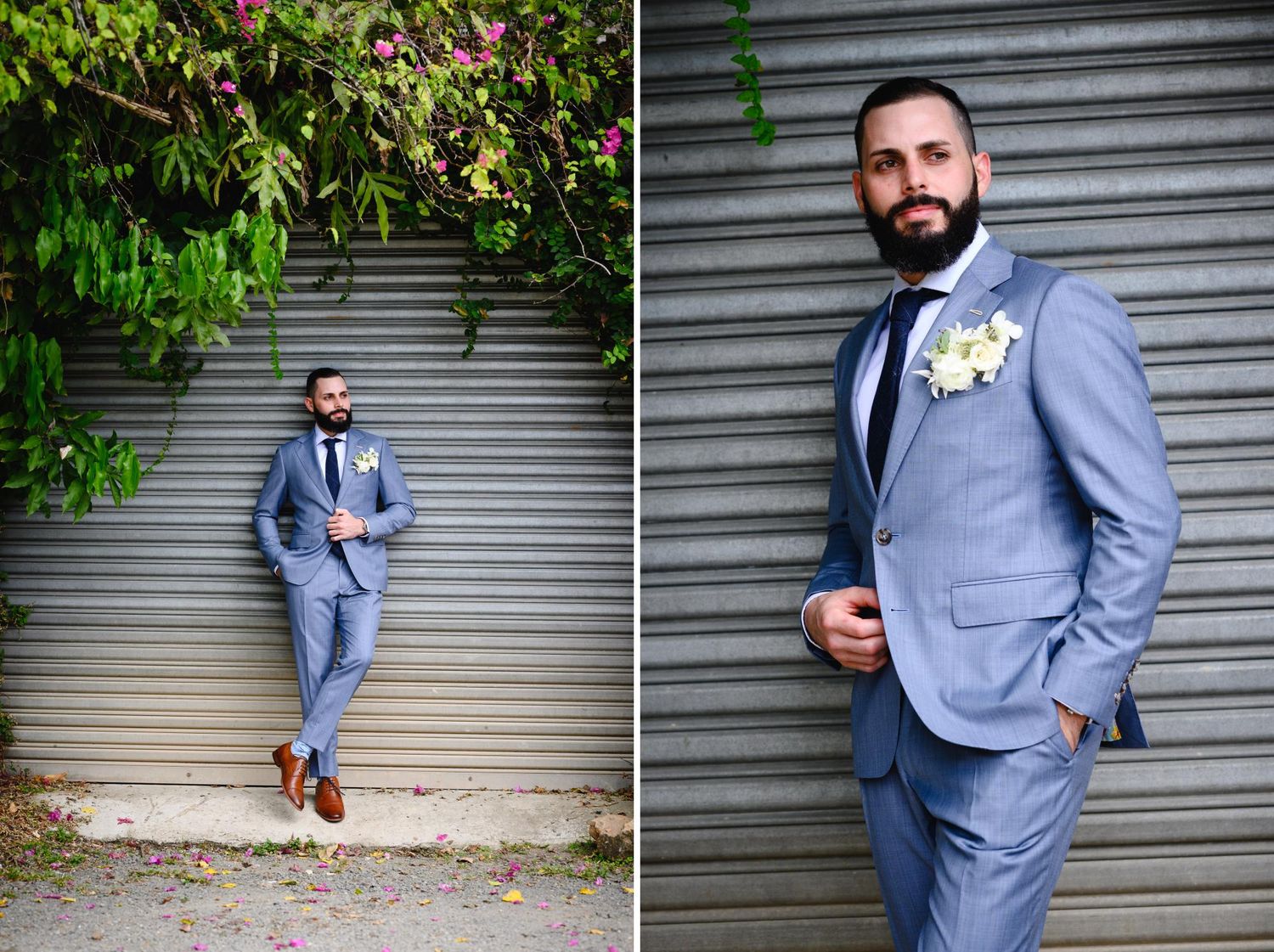 Dapper groom in light blue suit with floral boutonniere posing outdoors against a corrugated metal wall.
